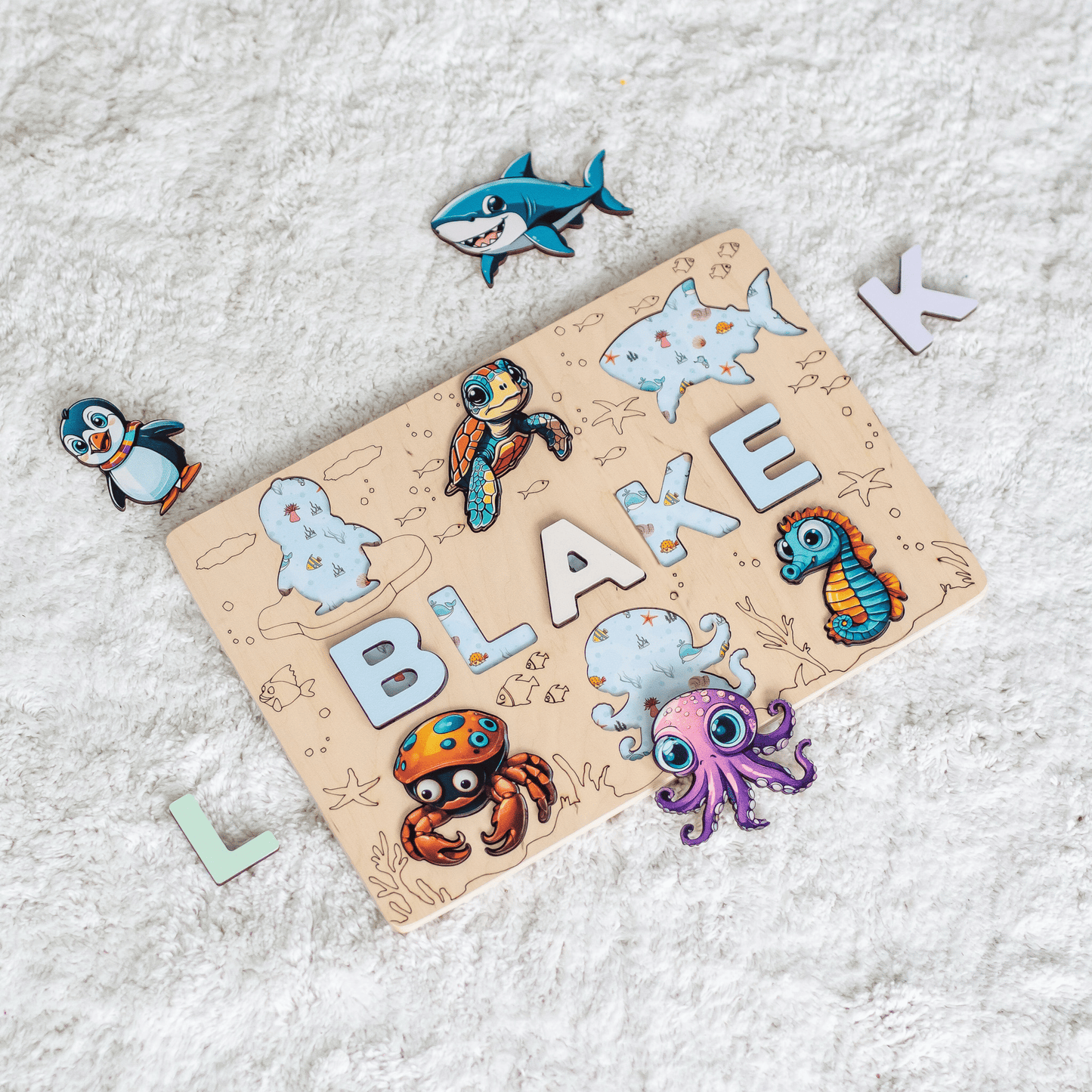 Wooden name puzzle with magnetic sea animals