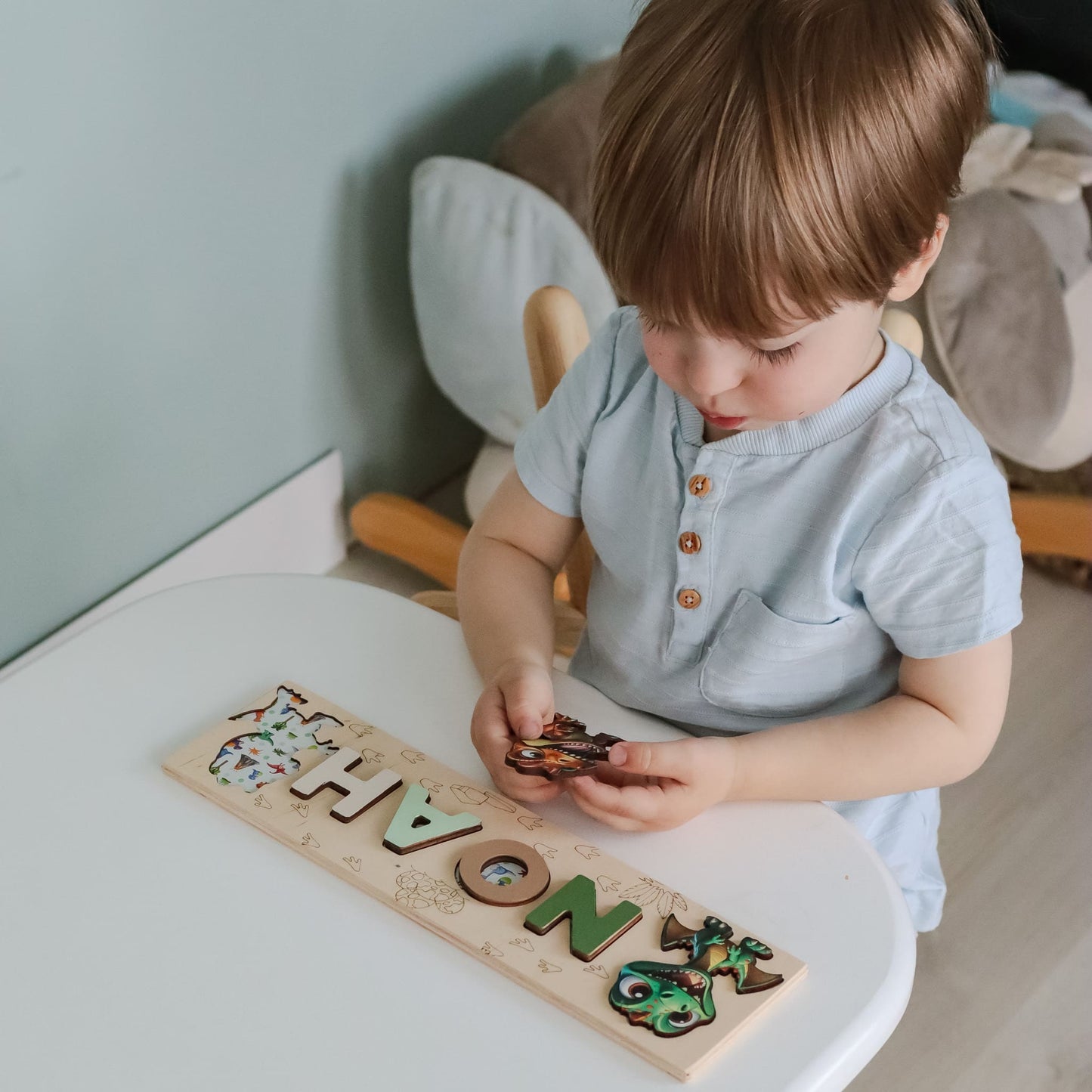 Alphabet puzzle with magnetic dinosaur animals