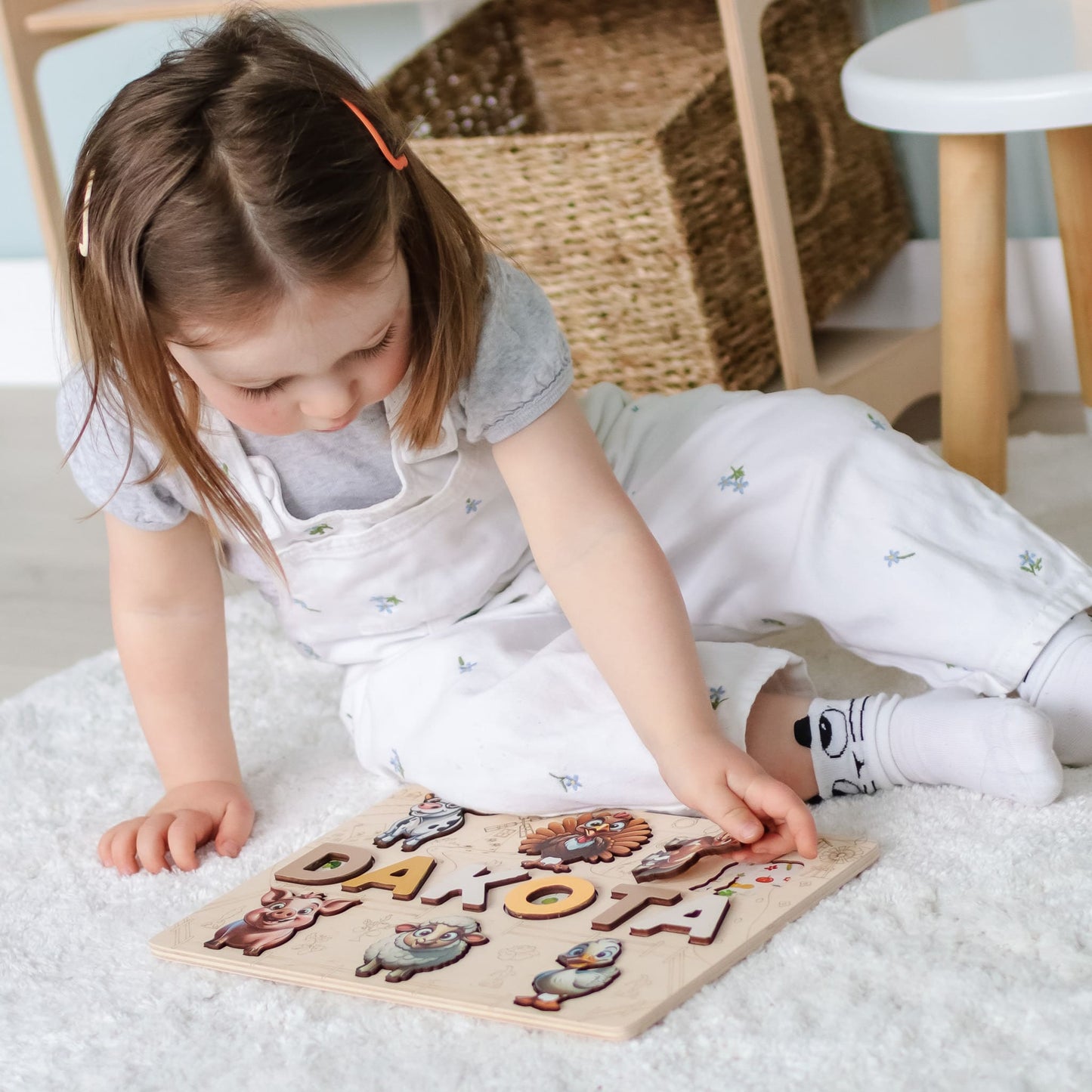 Wooden puzzle with child’s name and cow illustration