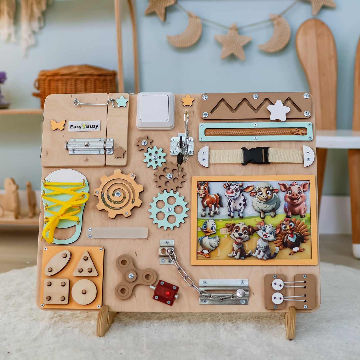 Magnetic pigs, cows, and sheep on a farm-themed sensory board