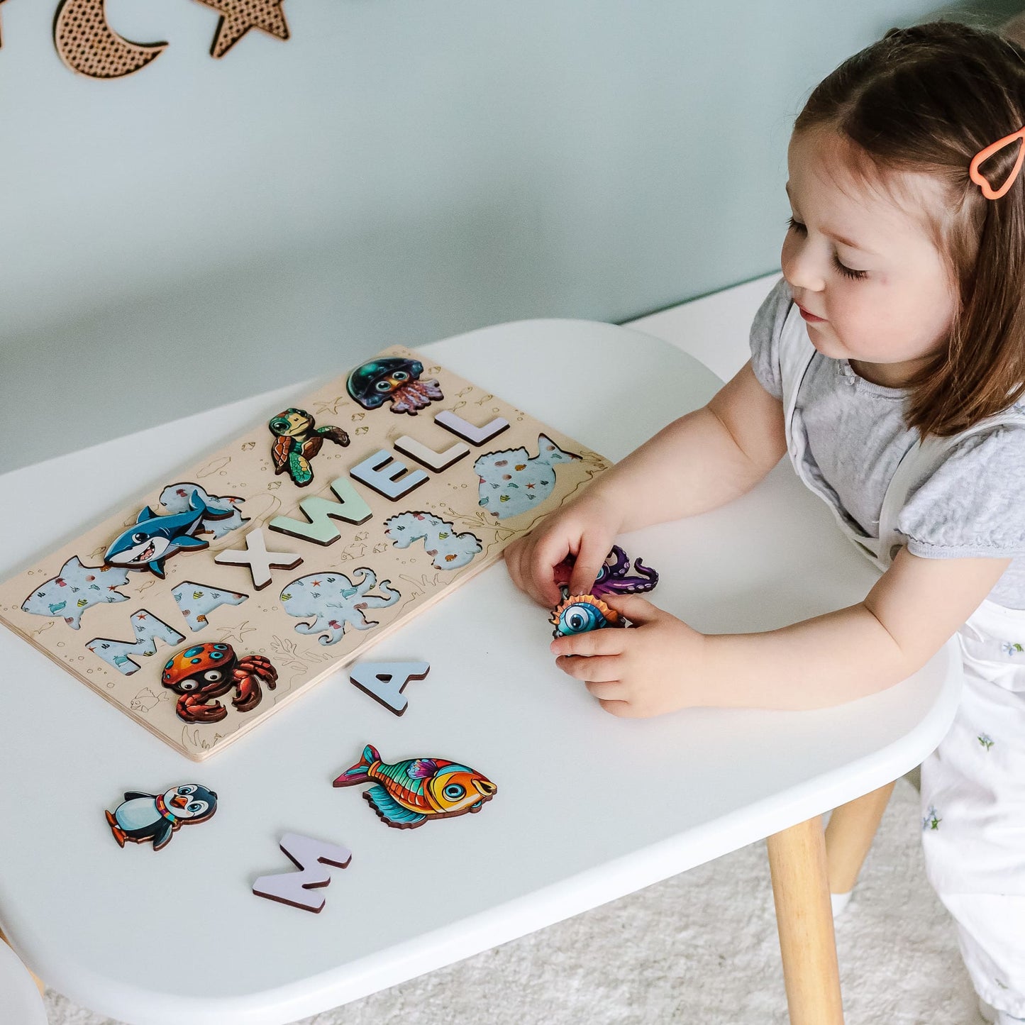 Montessori toy with child’s name and sea creatures
