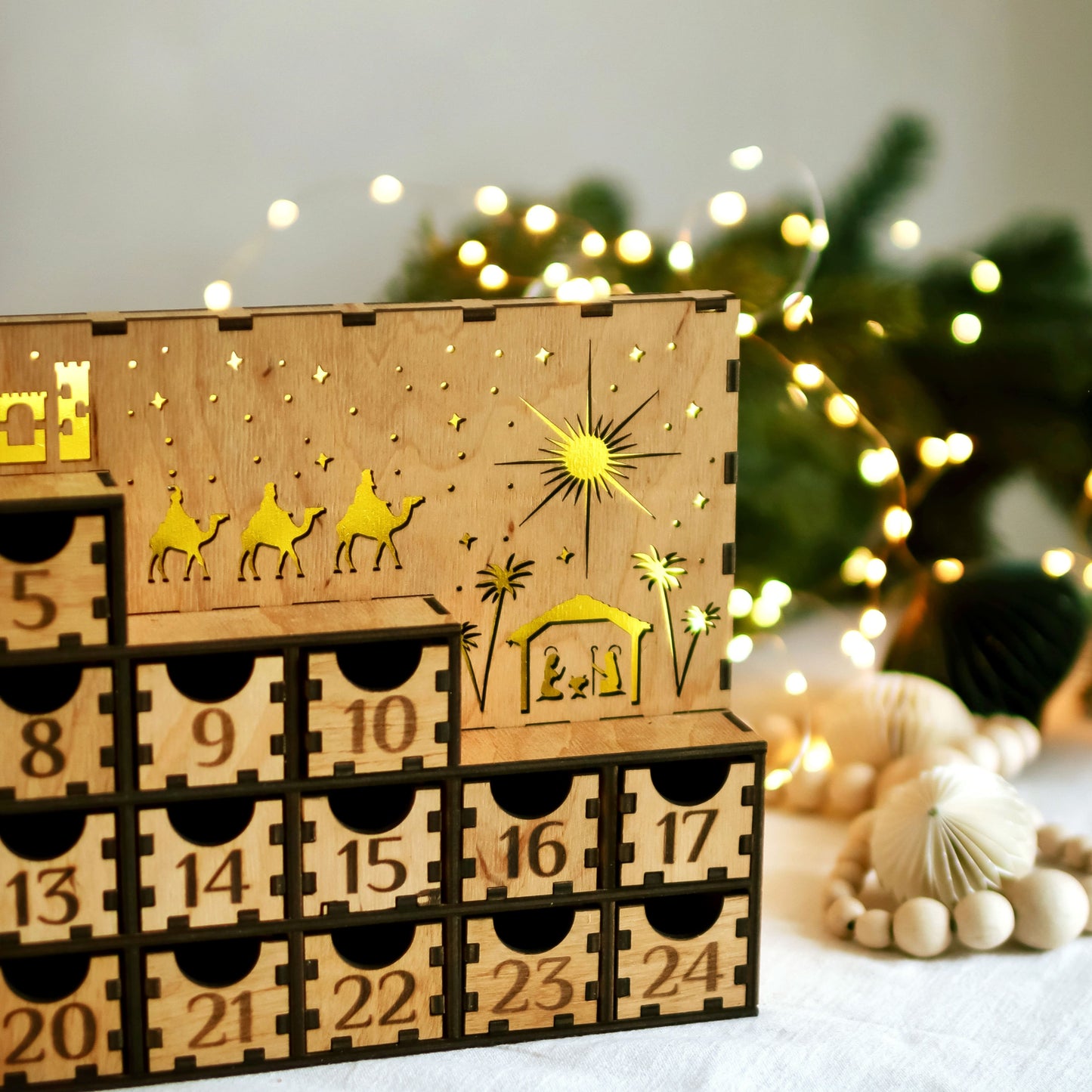Front View of Advent Calendar – A full view of the wooden Advent calendar showcasing its elegant holiday design, numbered drawers, and glowing LED lights