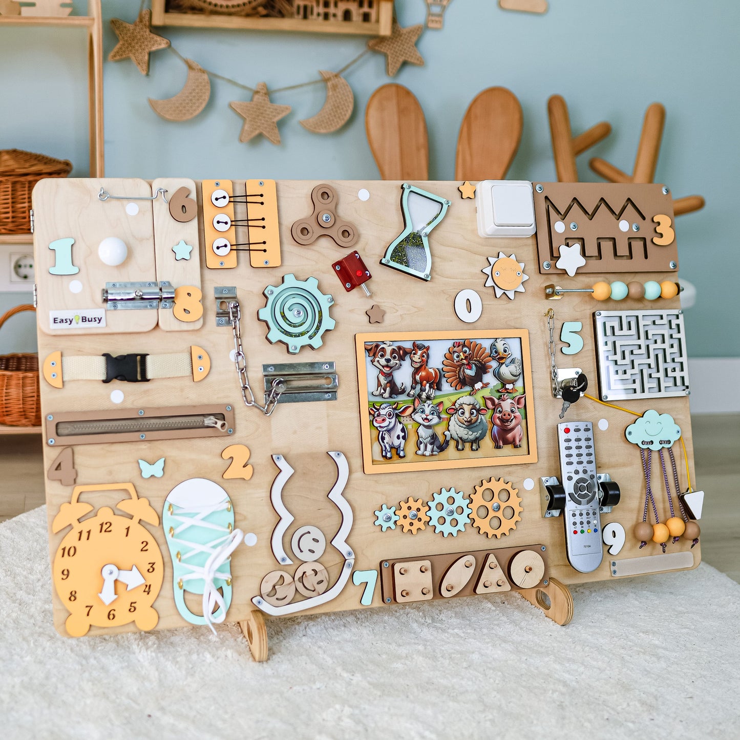 Toddler exploring a large educational farm-themed activity board