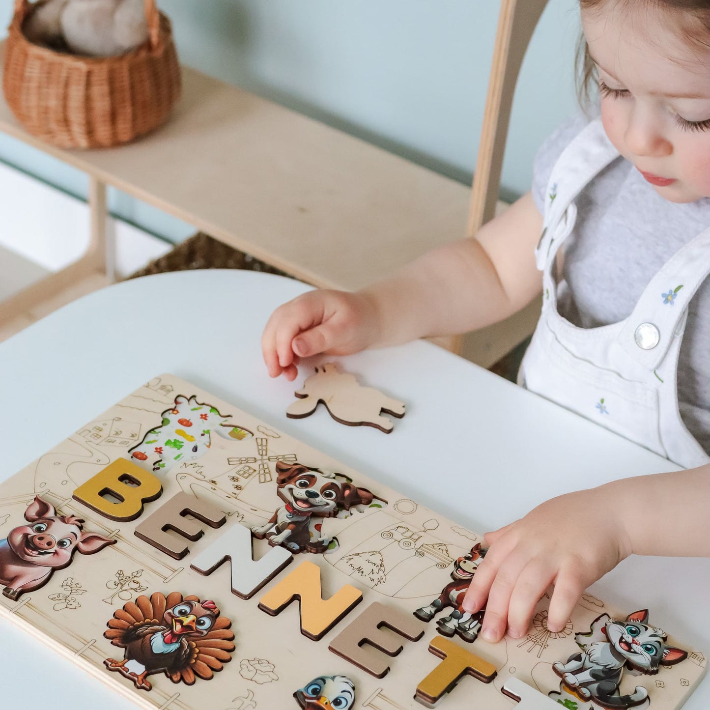 Child’s puzzle with wooden letters and rooster magnet