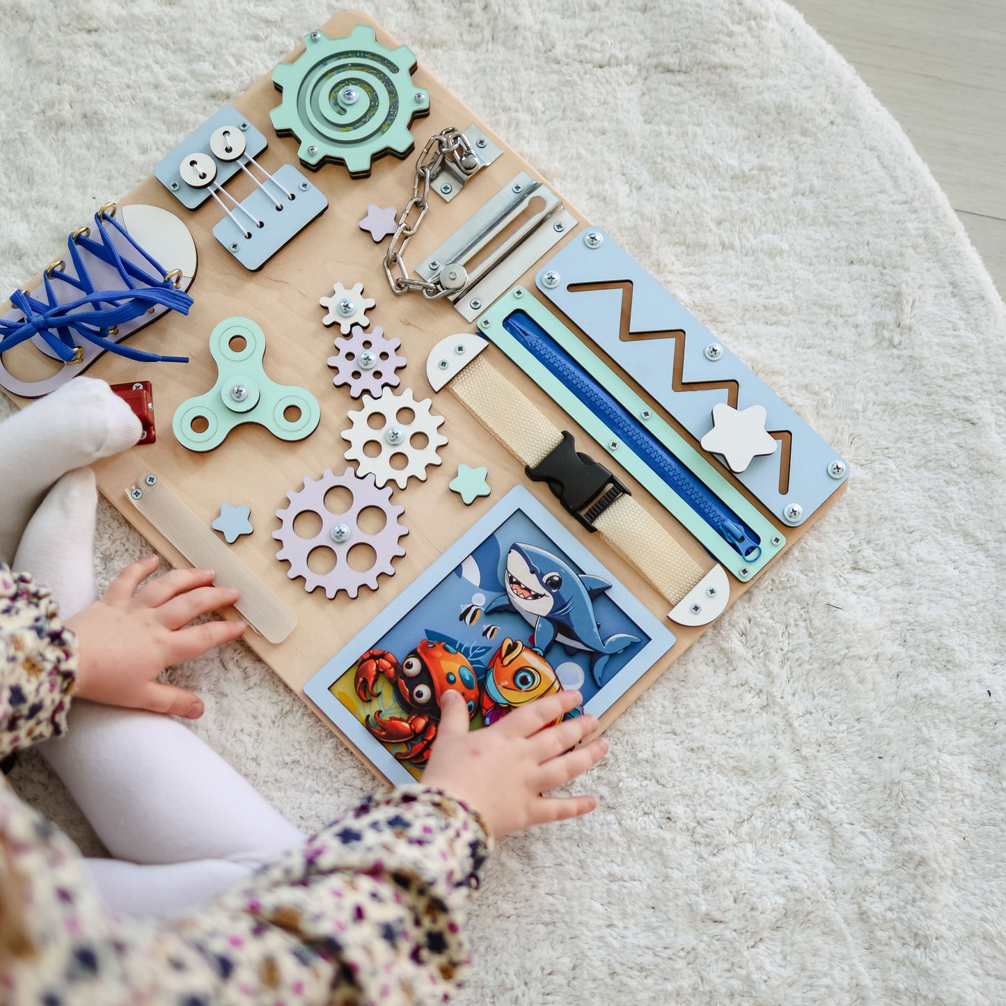 Fine motor skill development toy with a colorful coral reef background