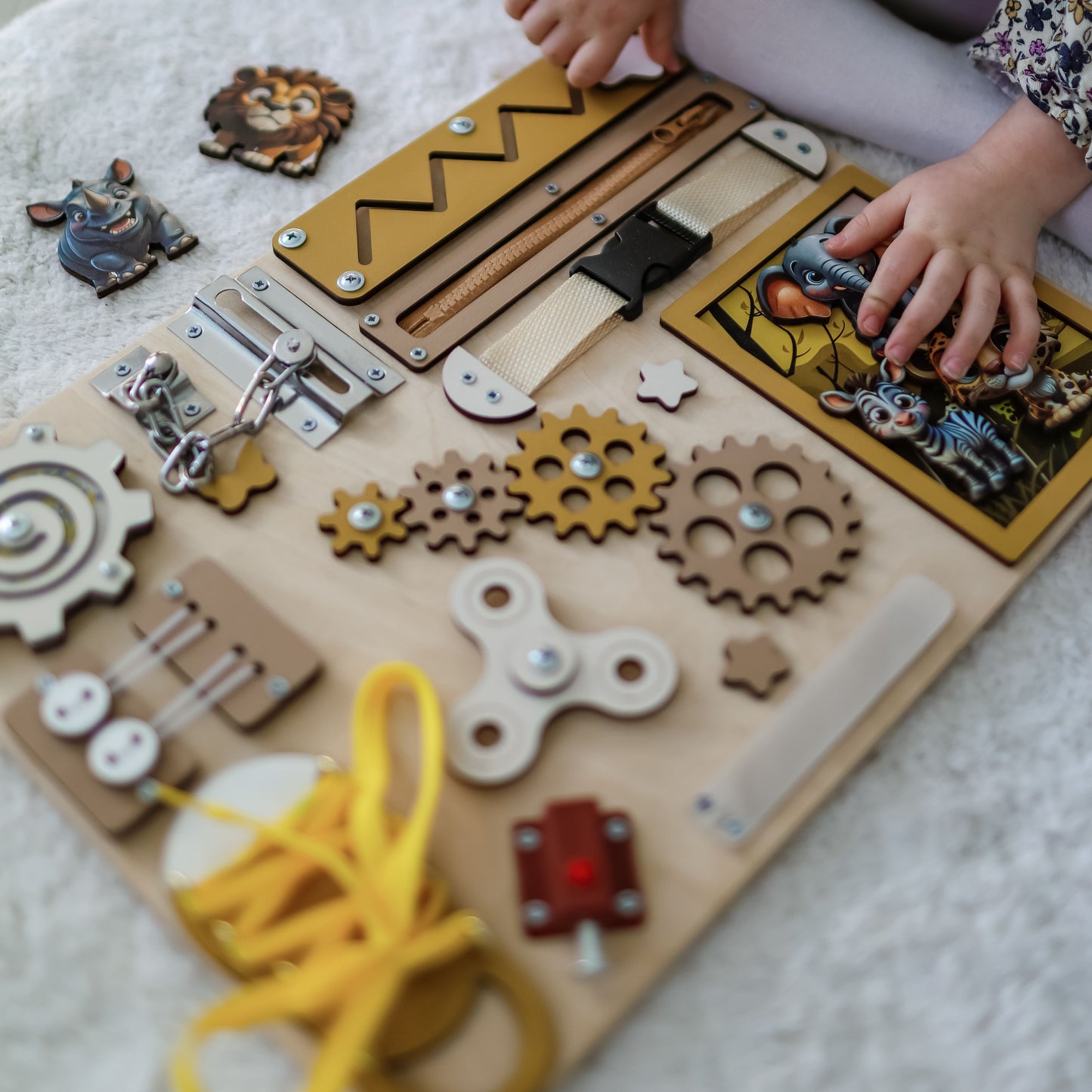 Fine motor skill development toy with a colorful jungle background