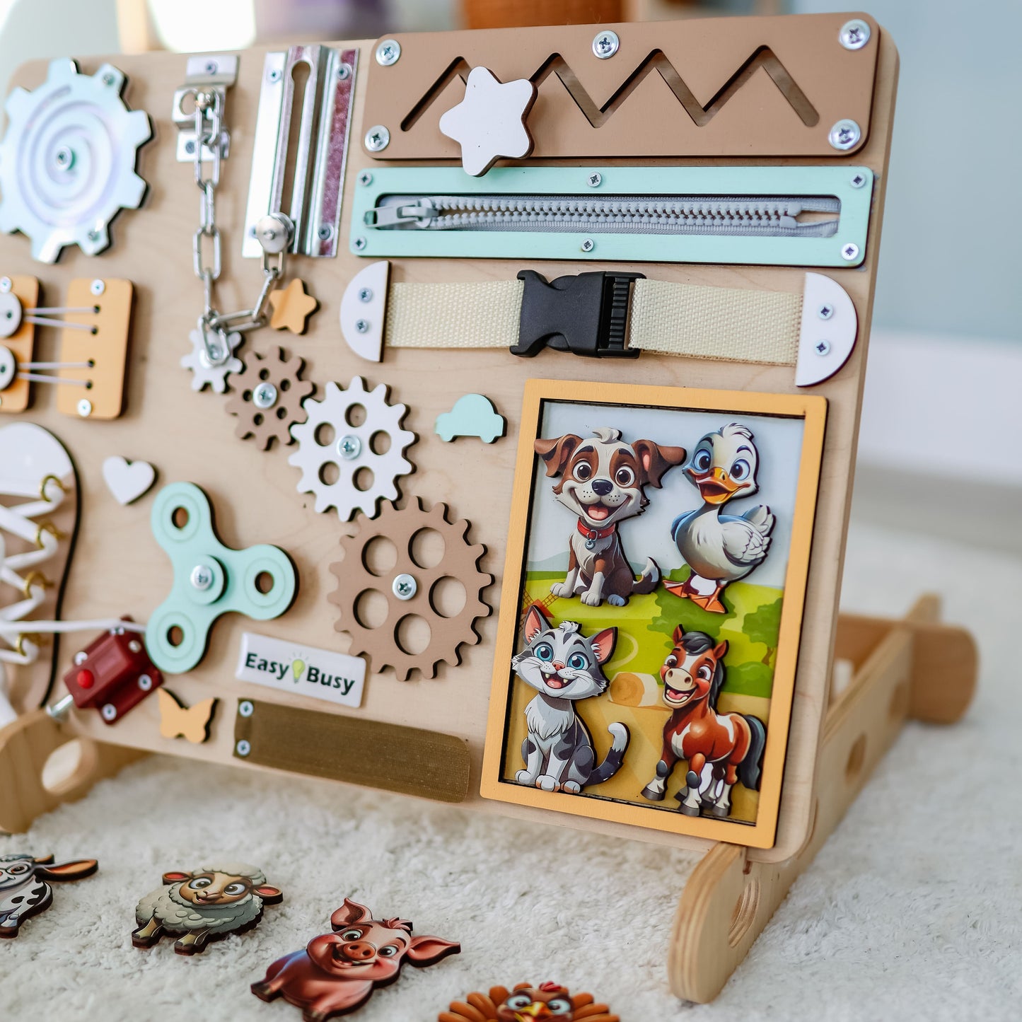Montessori sensory play board featuring cows, sheep, and chickens"