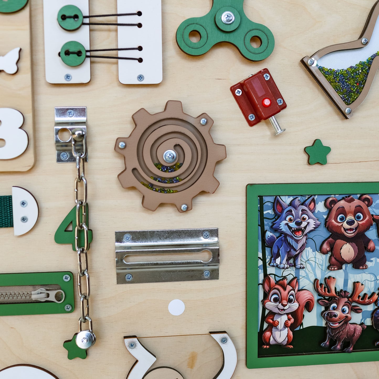 Handmade wooden busy board featuring a detailed woodland scene