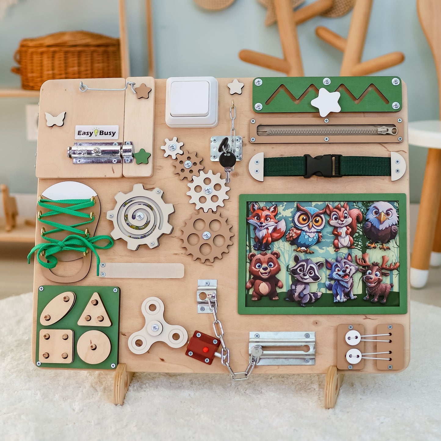 Magnetic owl and deer on a sensory play activity board