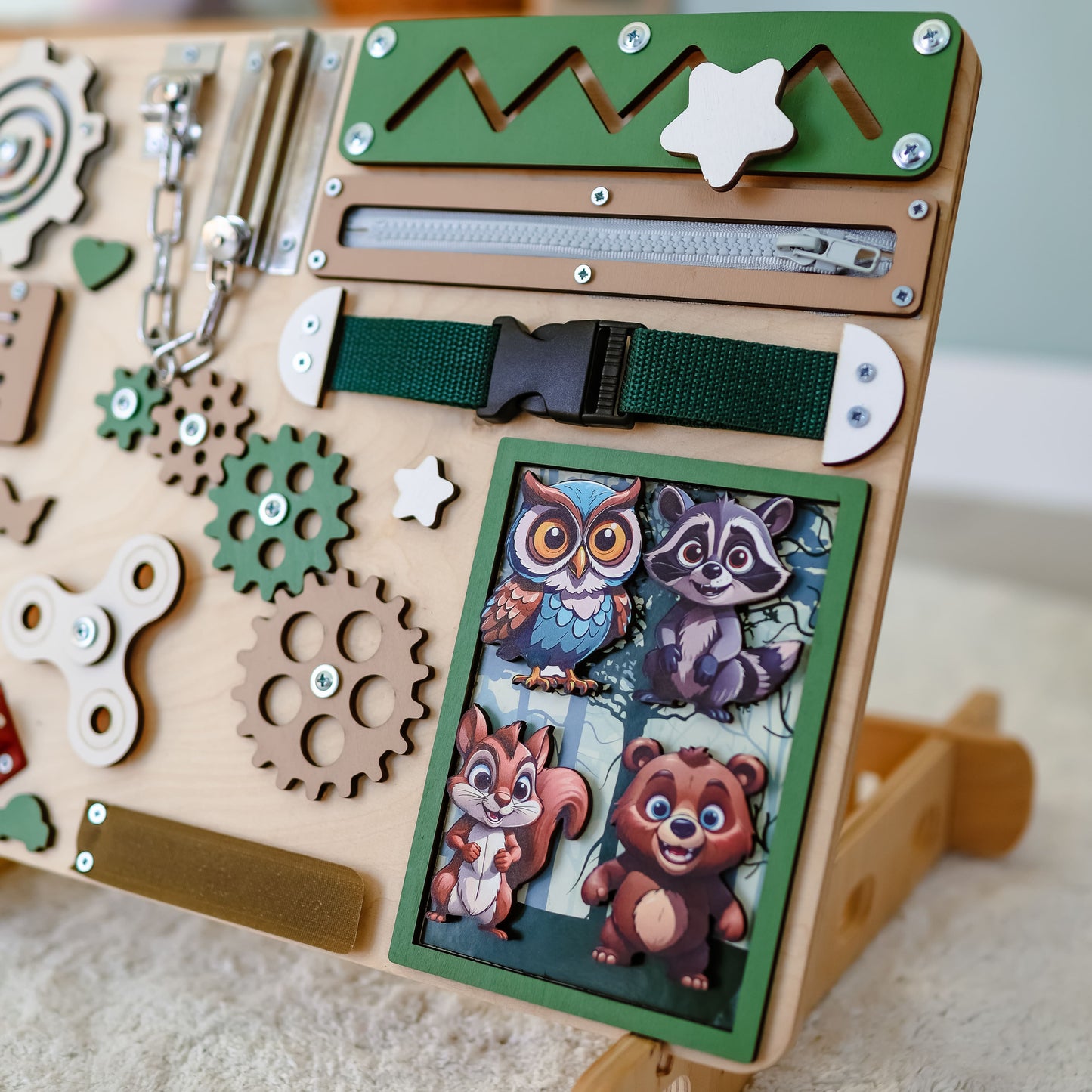 Montessori sensory board featuring an interactive nature scene