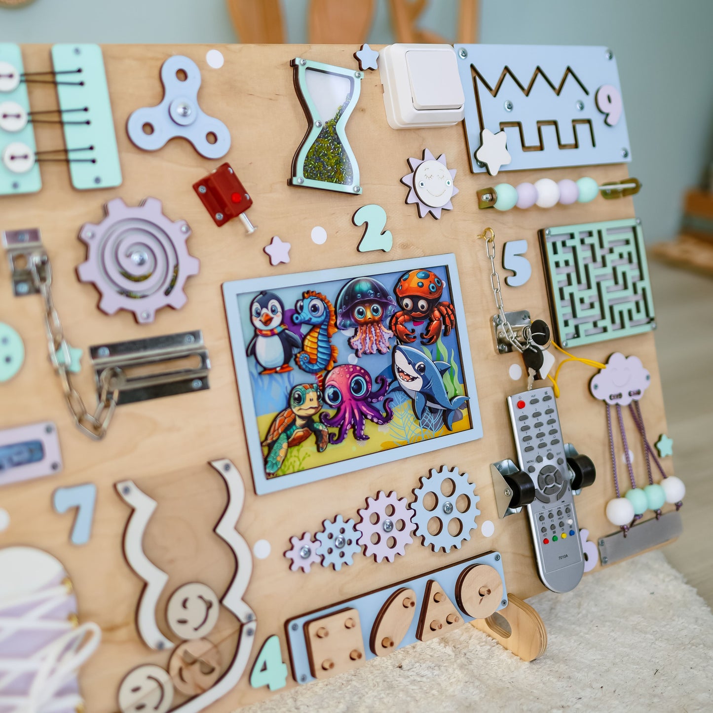 Sea-themed learning toy for toddlers with fine motor skill activities