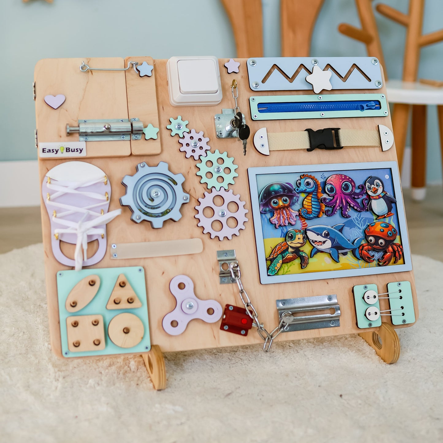 Handmade ocean-themed Montessori activity board with removable magnetic animals