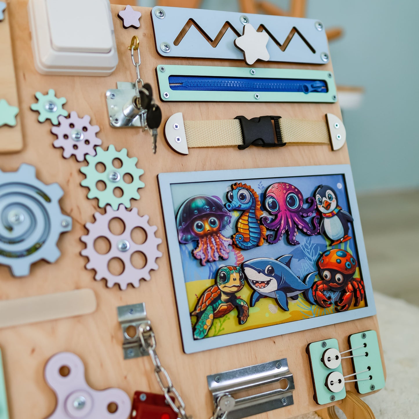 Fine motor skill development toy with a colorful coral reef background