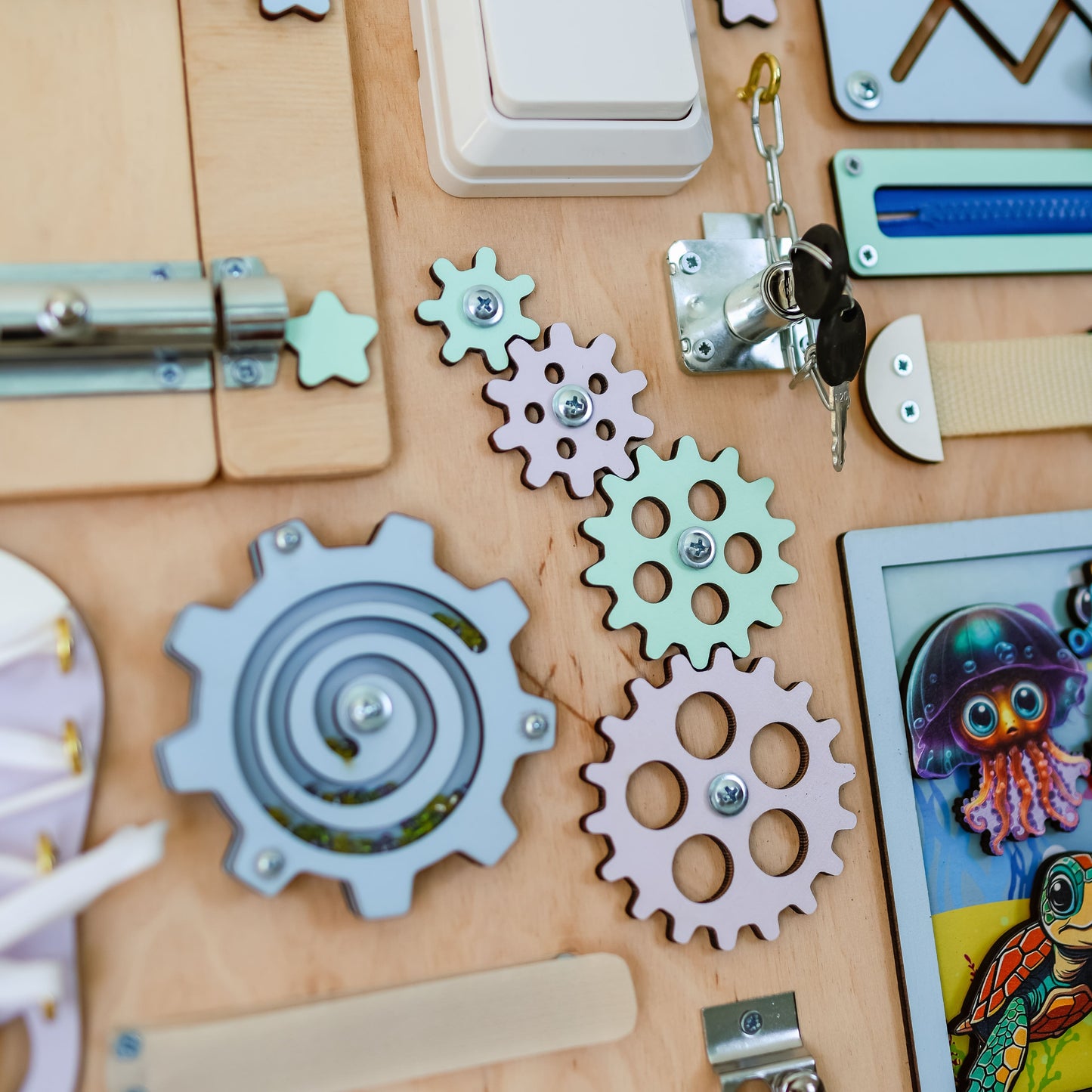 Montessori-inspired sensory board featuring whales, octopuses, and starfish
