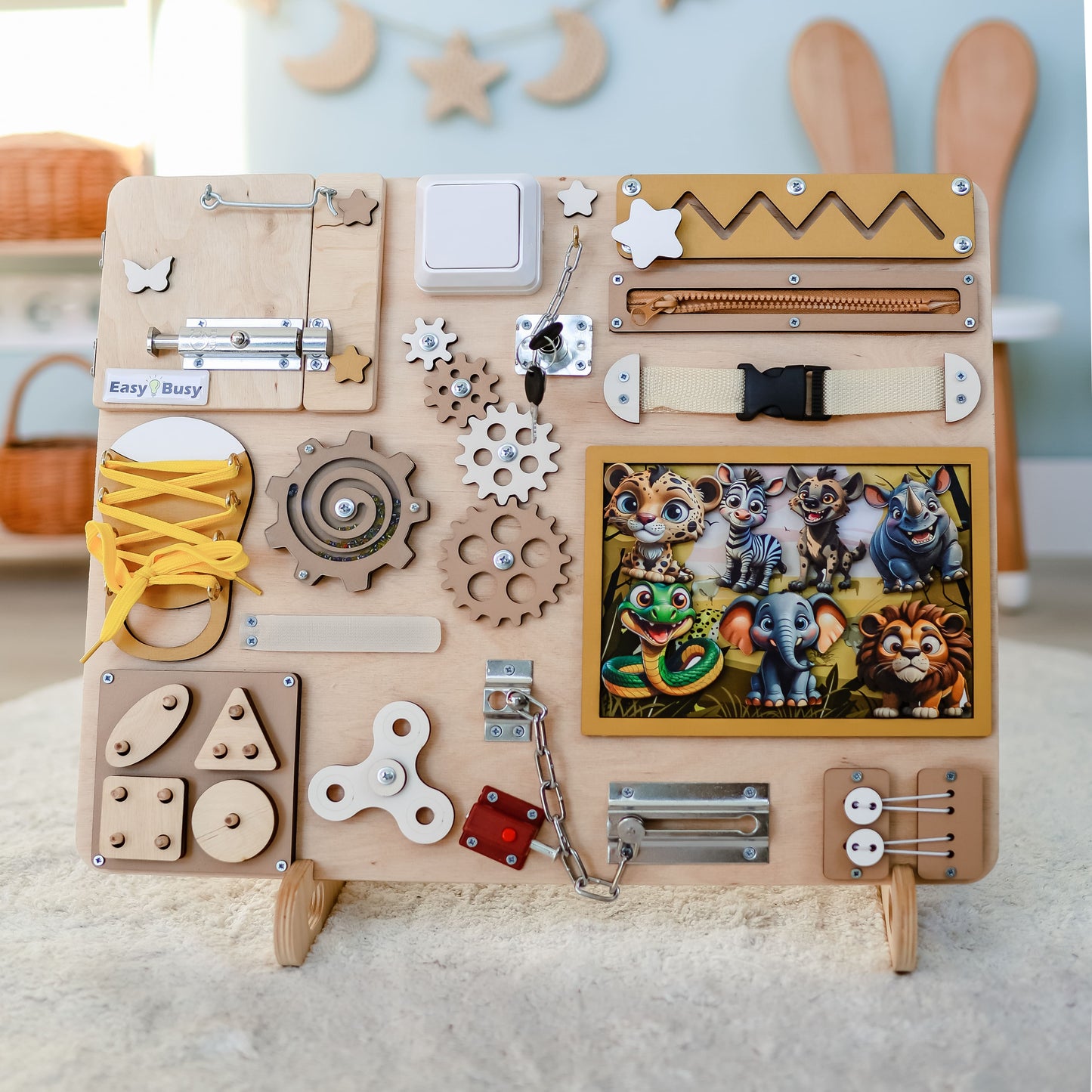 Handmade safari-themed busy board with removable magnetic animals