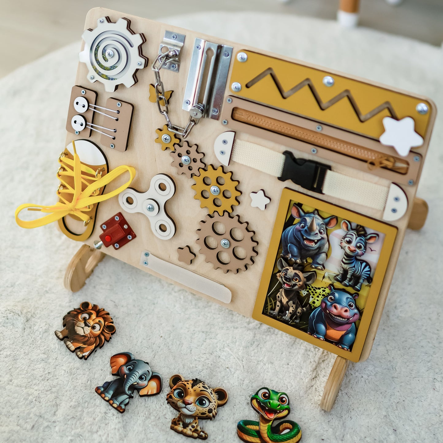 Handcrafted wooden activity board with a vibrant African landscape