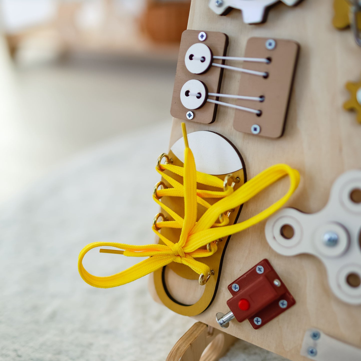 Montessori-inspired busy board for fine motor skill development