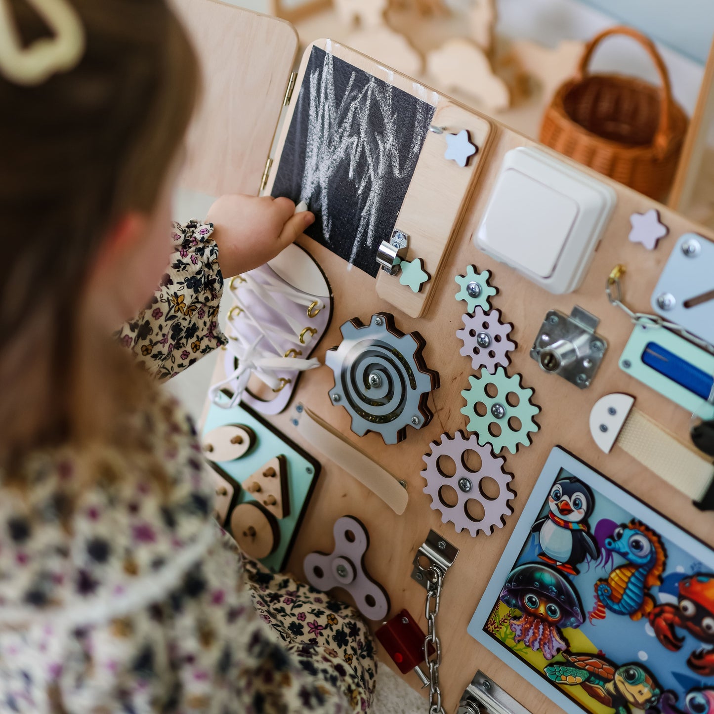 Interactive marine animals on a handcrafted wooden ocean busy board