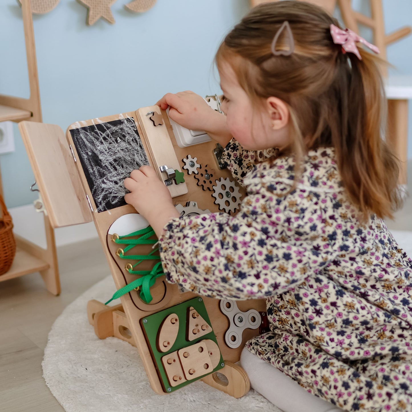 Close-up of magnetic animals on a forest-themed activity panel