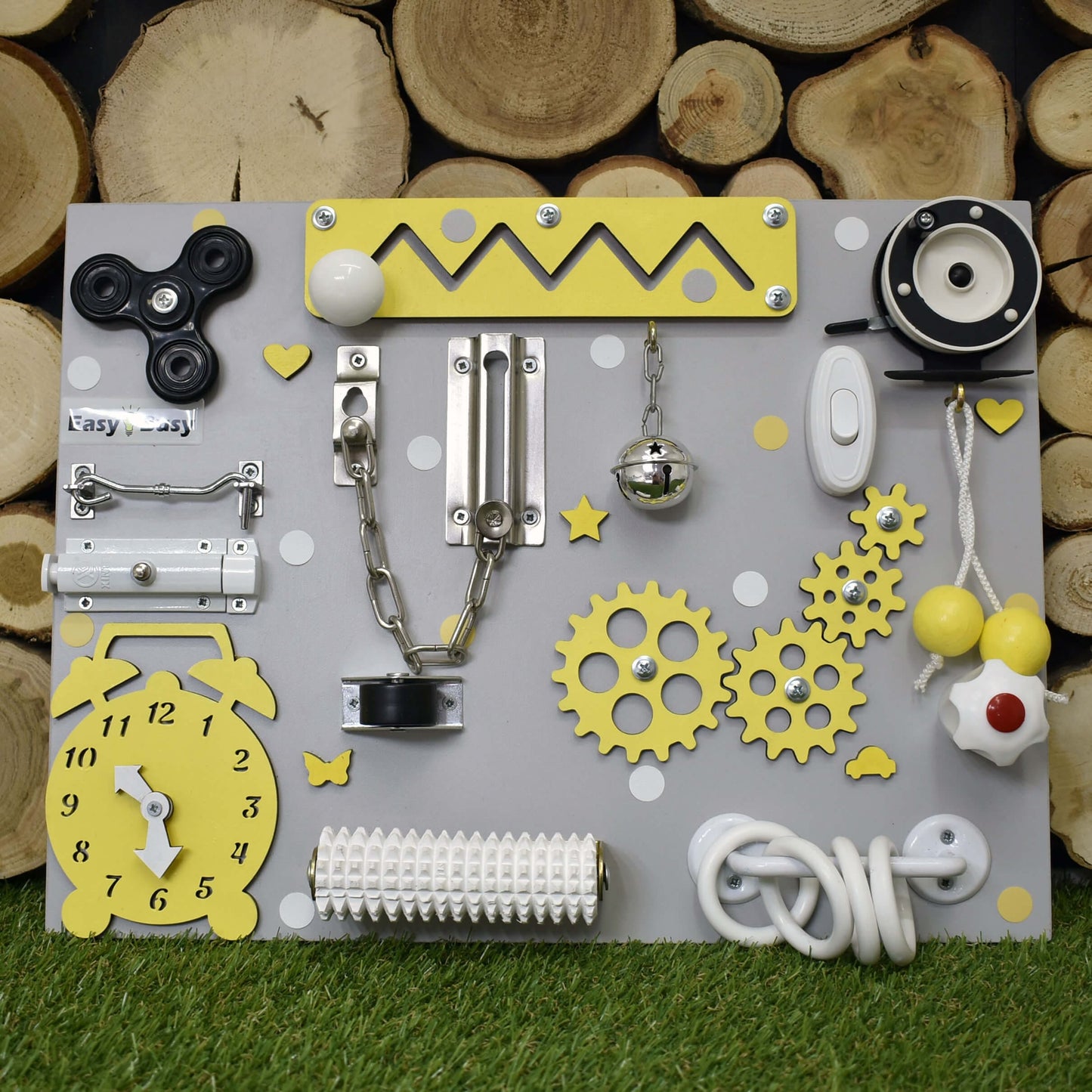 Bright yellow busy board with spinner and colorful gears
