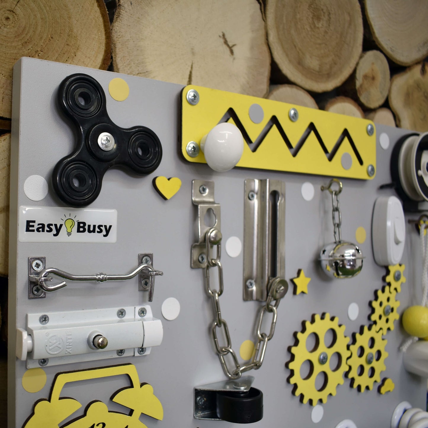 Interactive activity board for toddlers with real-life elements