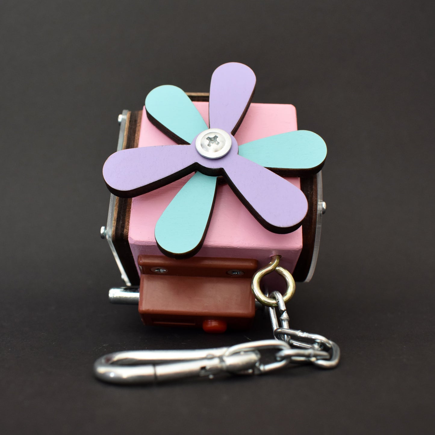 Close-up of Montessori cube with colorful spinning wheel