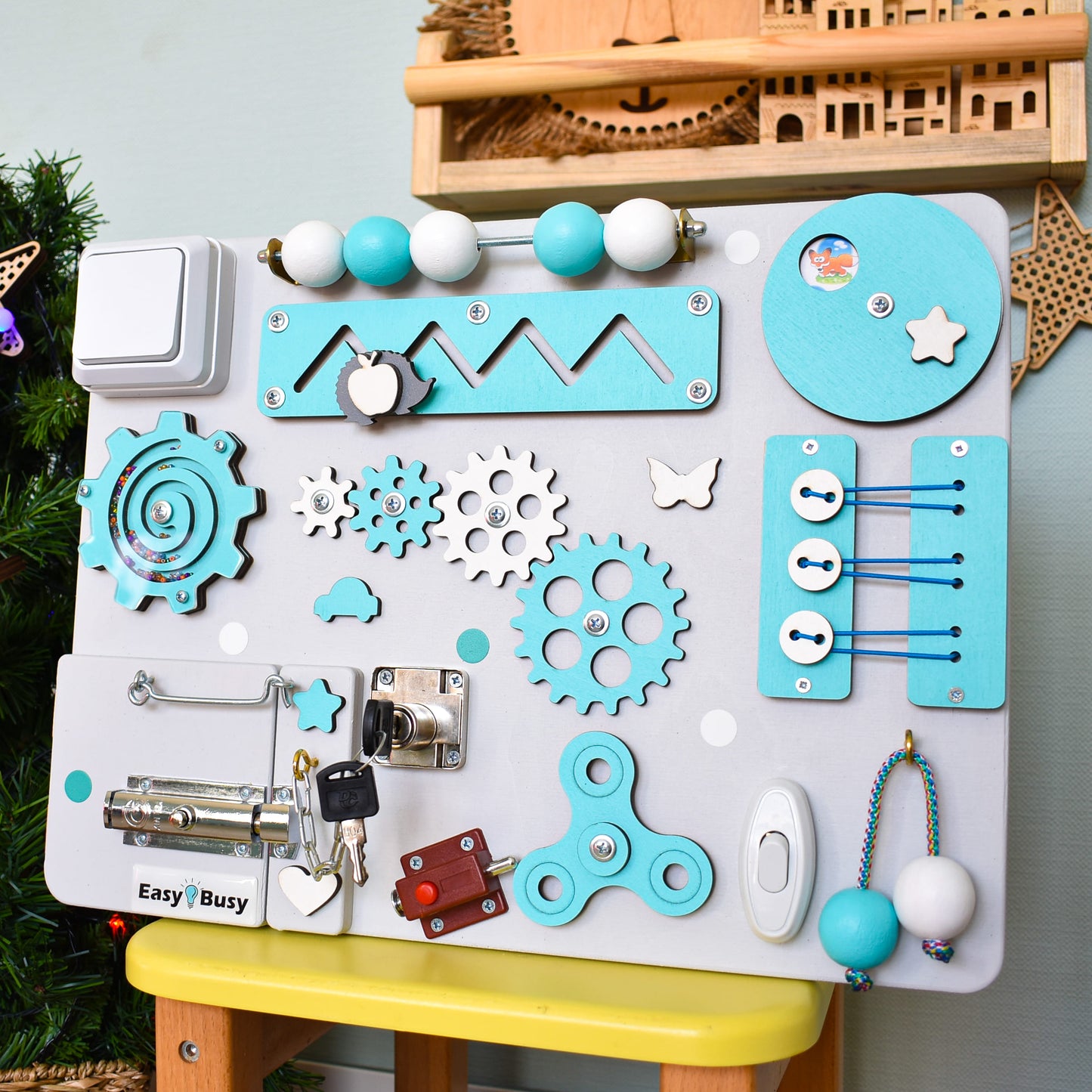 Handmade educational activity board in pastel tones