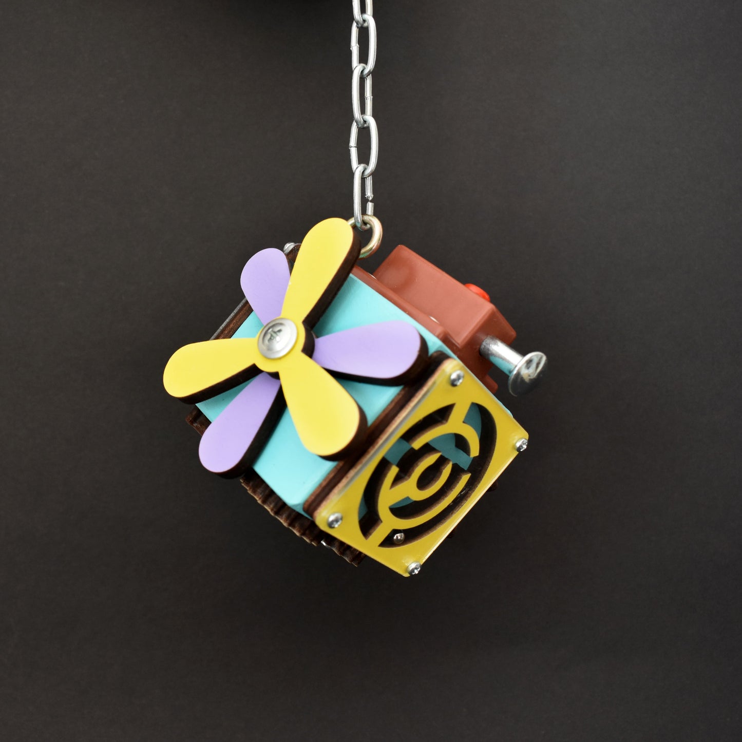 Busy cube with car motif and spinning parts