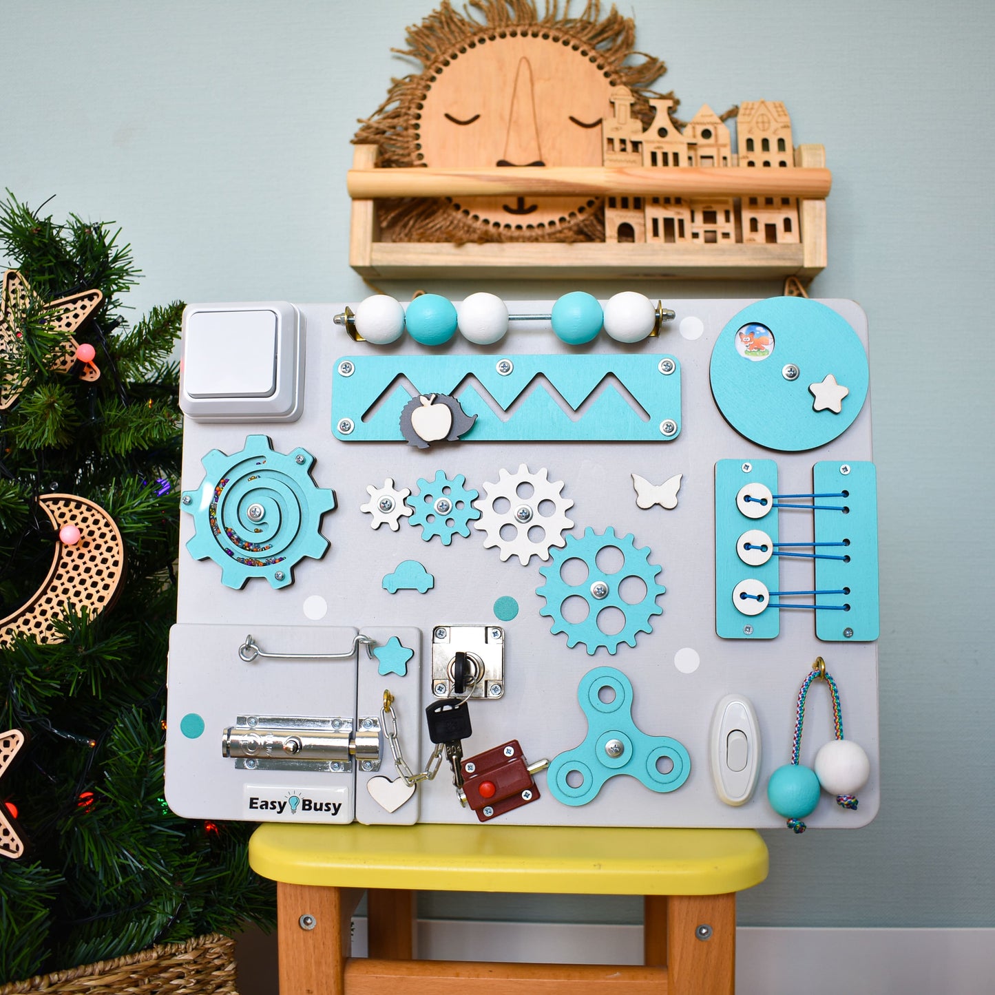 Busy board with light switch, bell, and motor elements