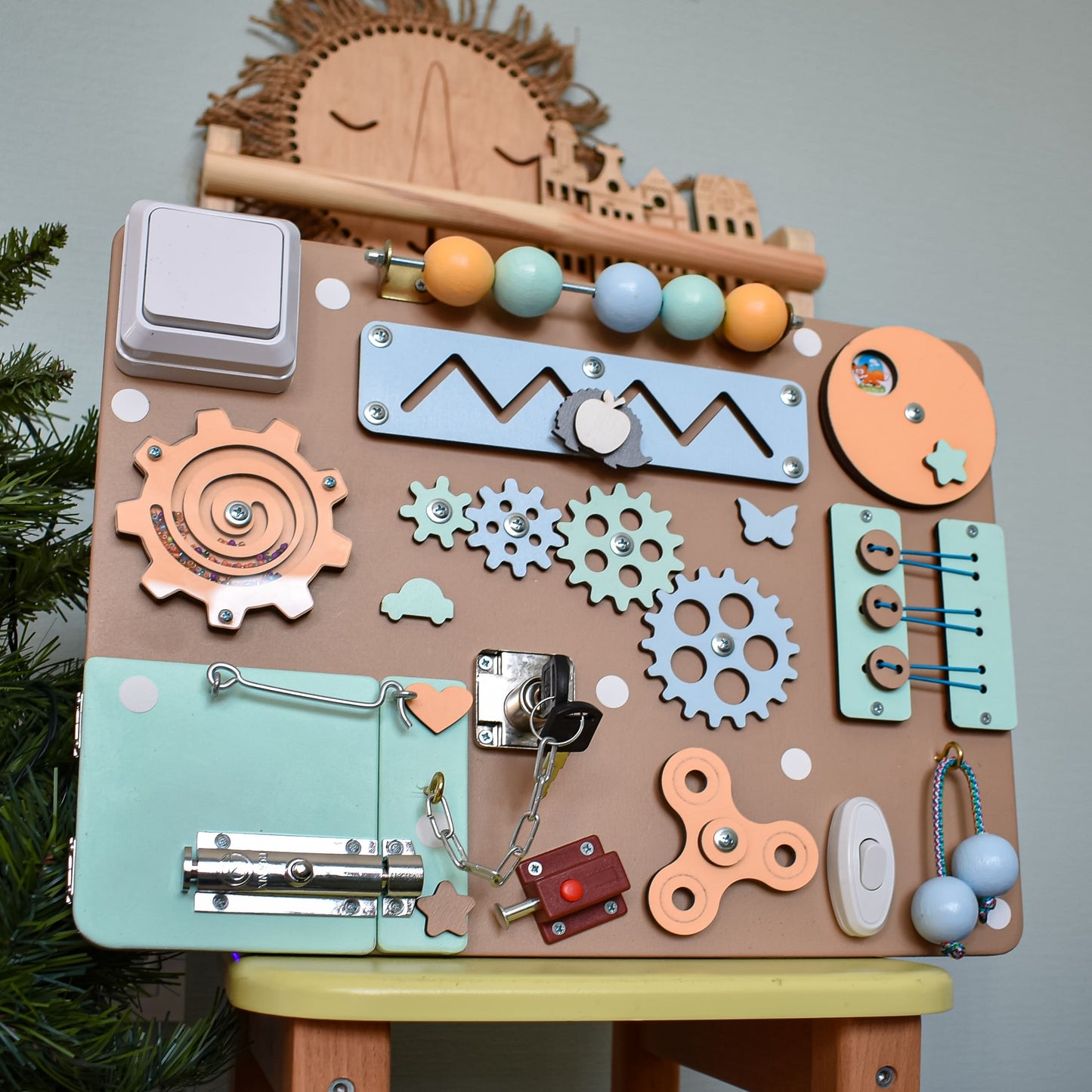 Toddler activity board with key lock and gears
