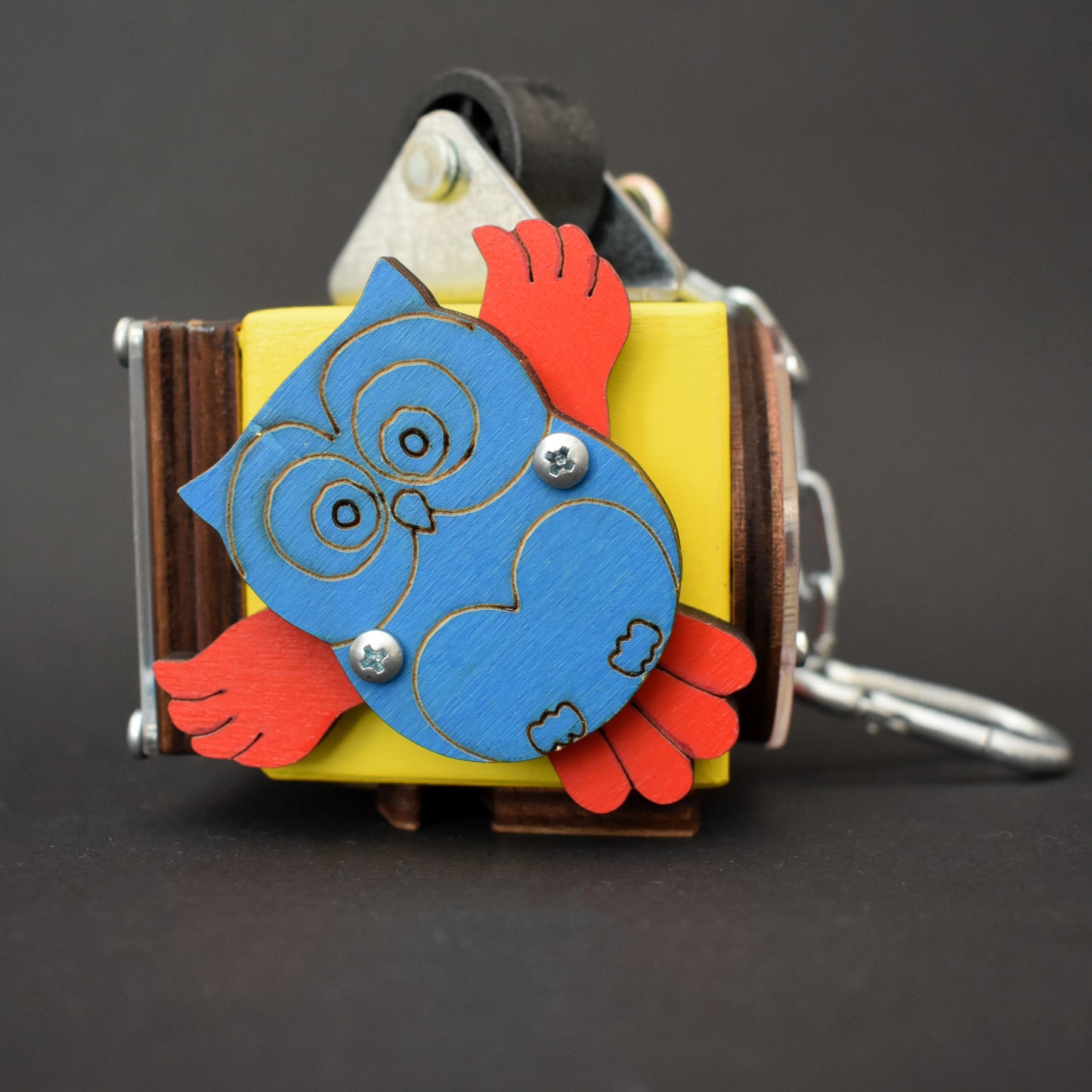 Toy cube with rotating flower and hook