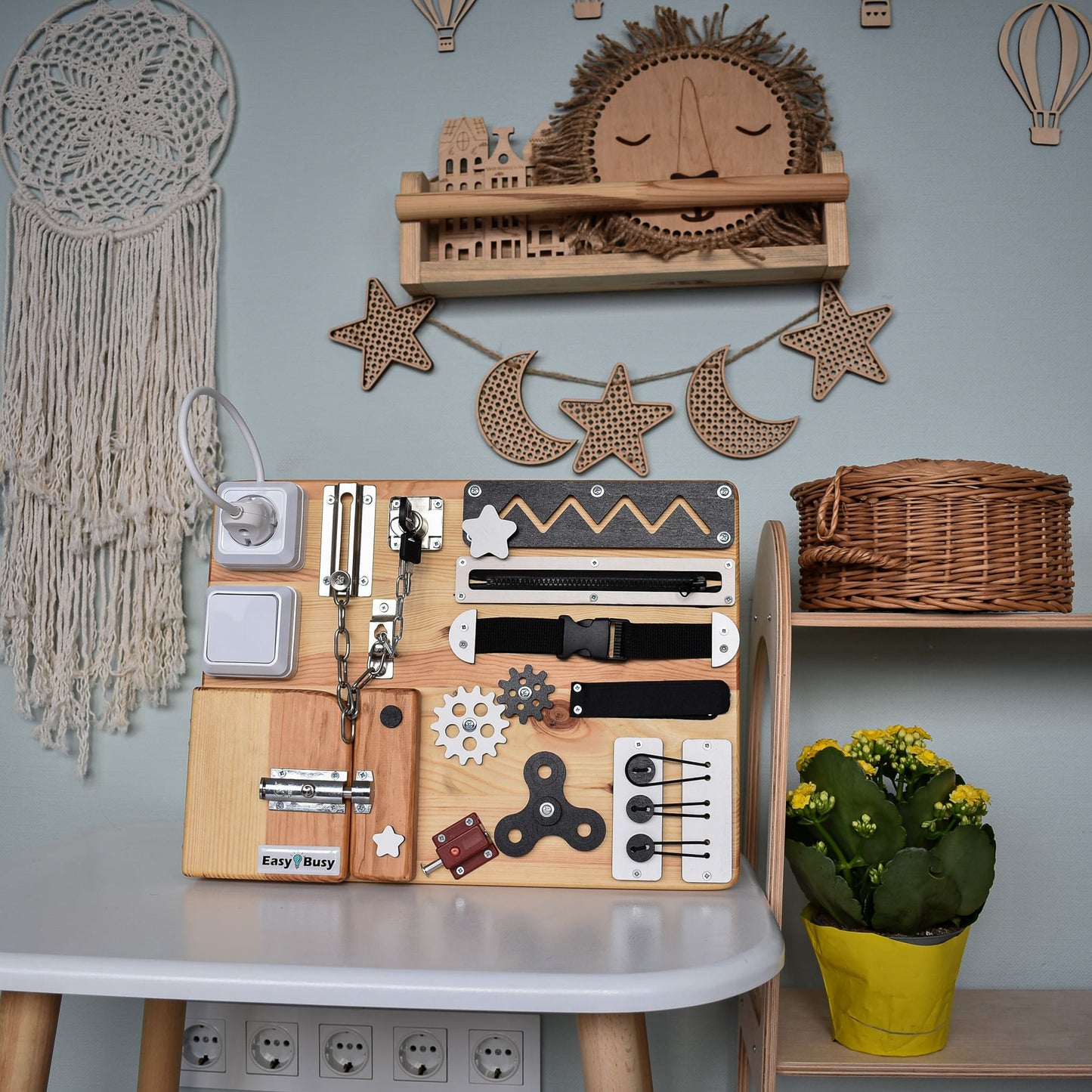 Handmade wooden busy board with neutral design