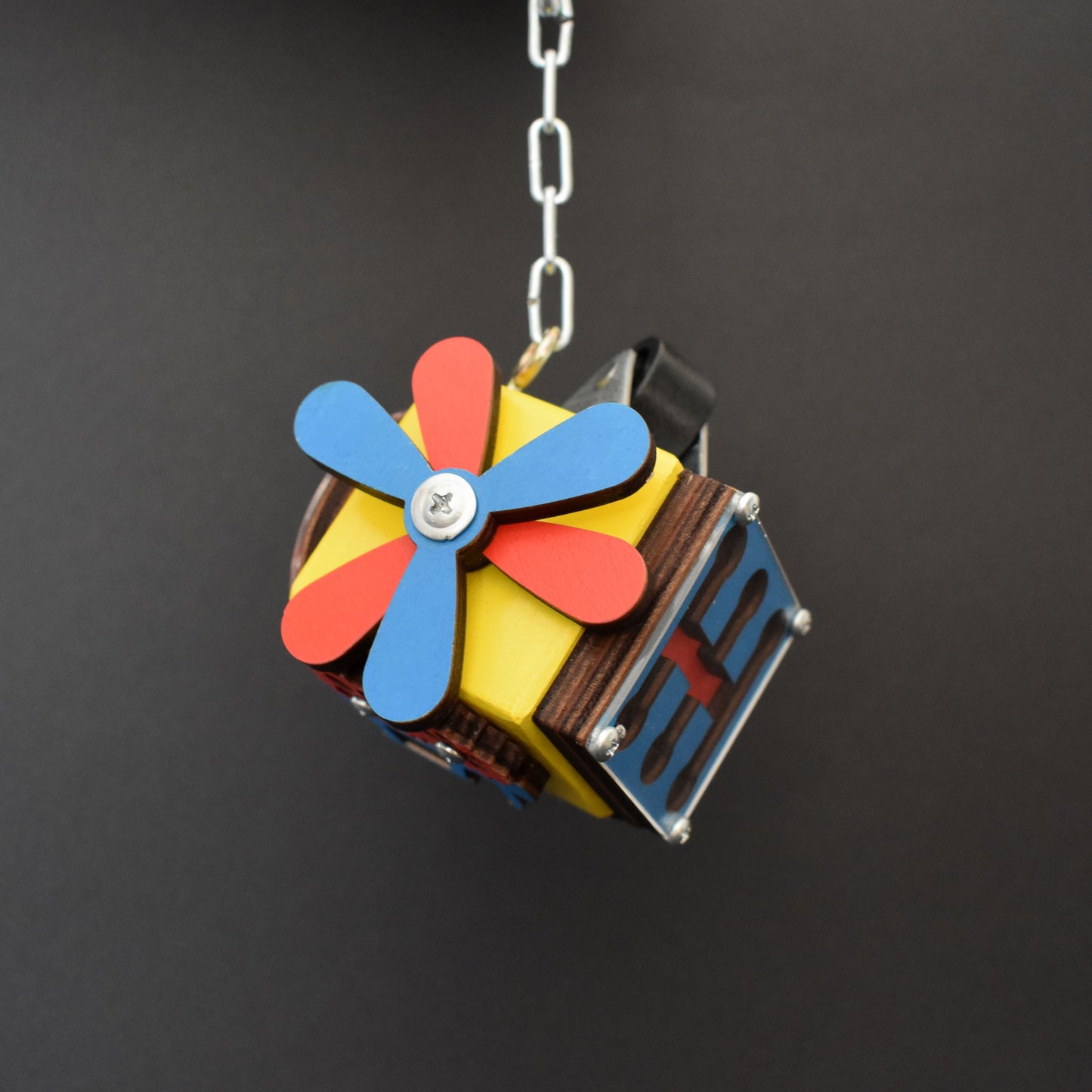 Miniature cube toy with pastel sun design