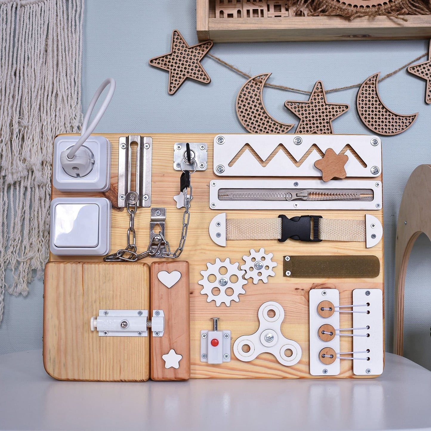 Educational busy board with light switch and zipper