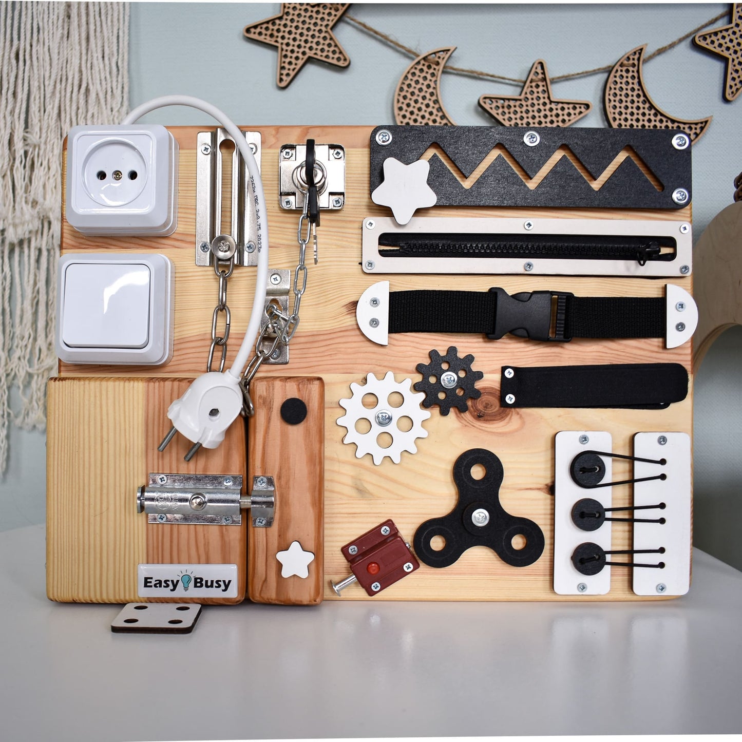 Tactile play board with hook chain and plug