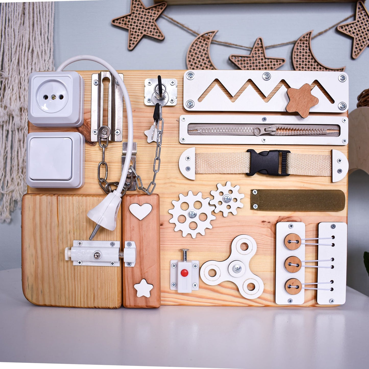 Close-up of latch and lock on Montessori toddler board