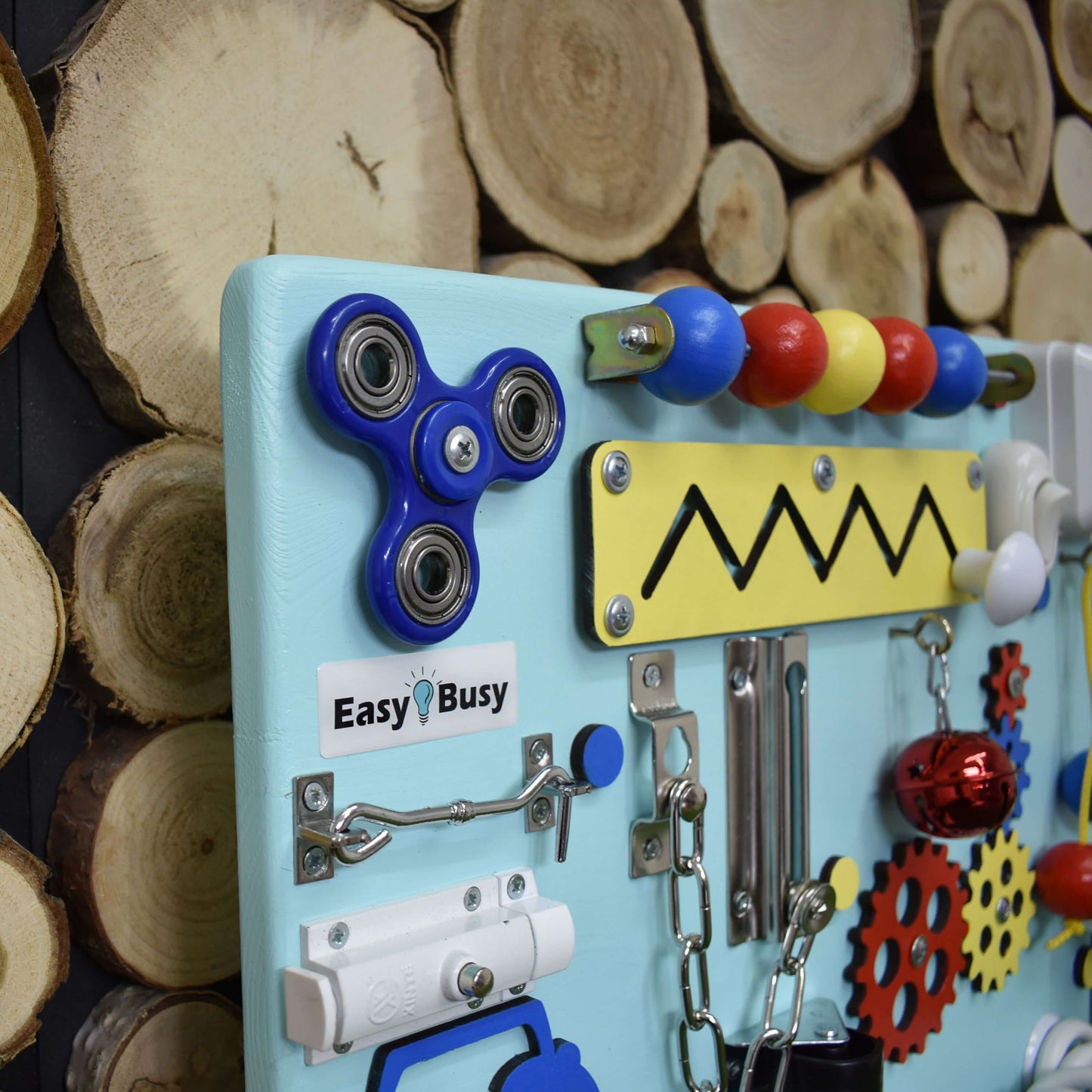Personalized busy board with child’s name and vibrant gears