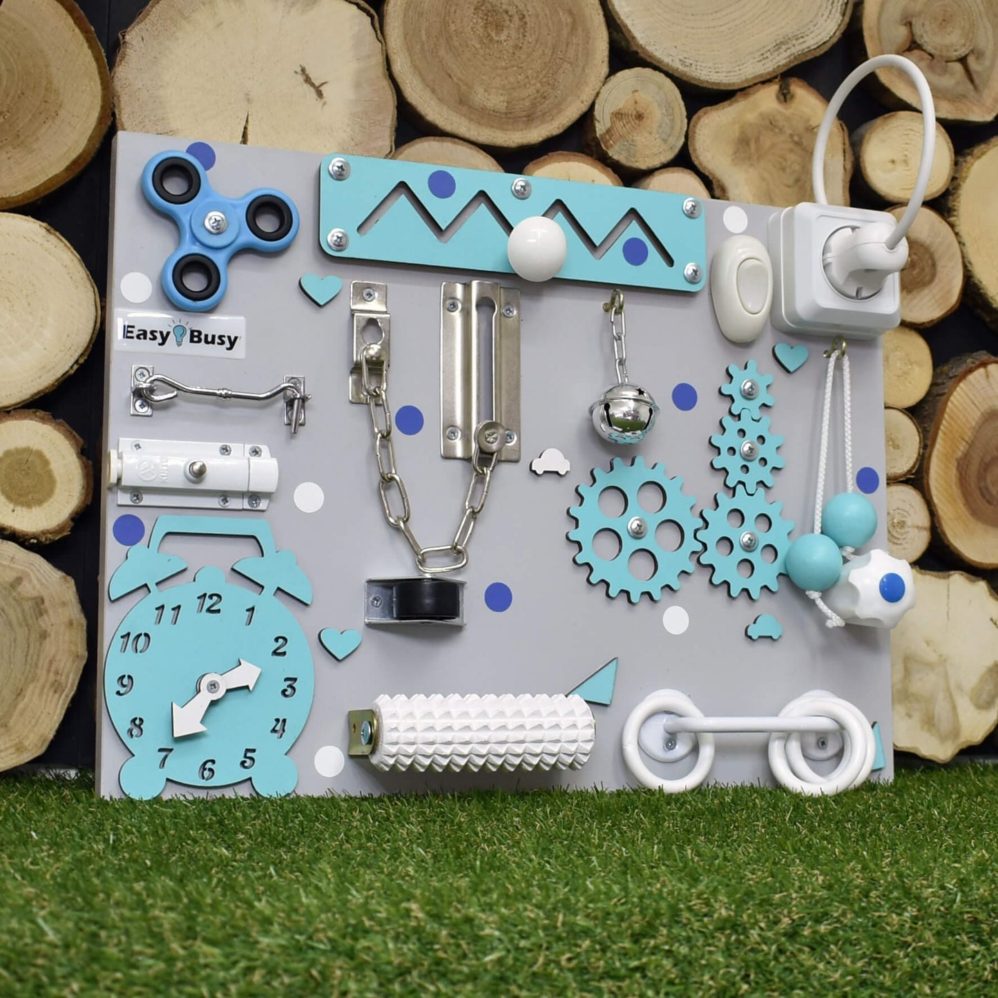 Yellow toddler sensory board with spinning reel, bell, and gears