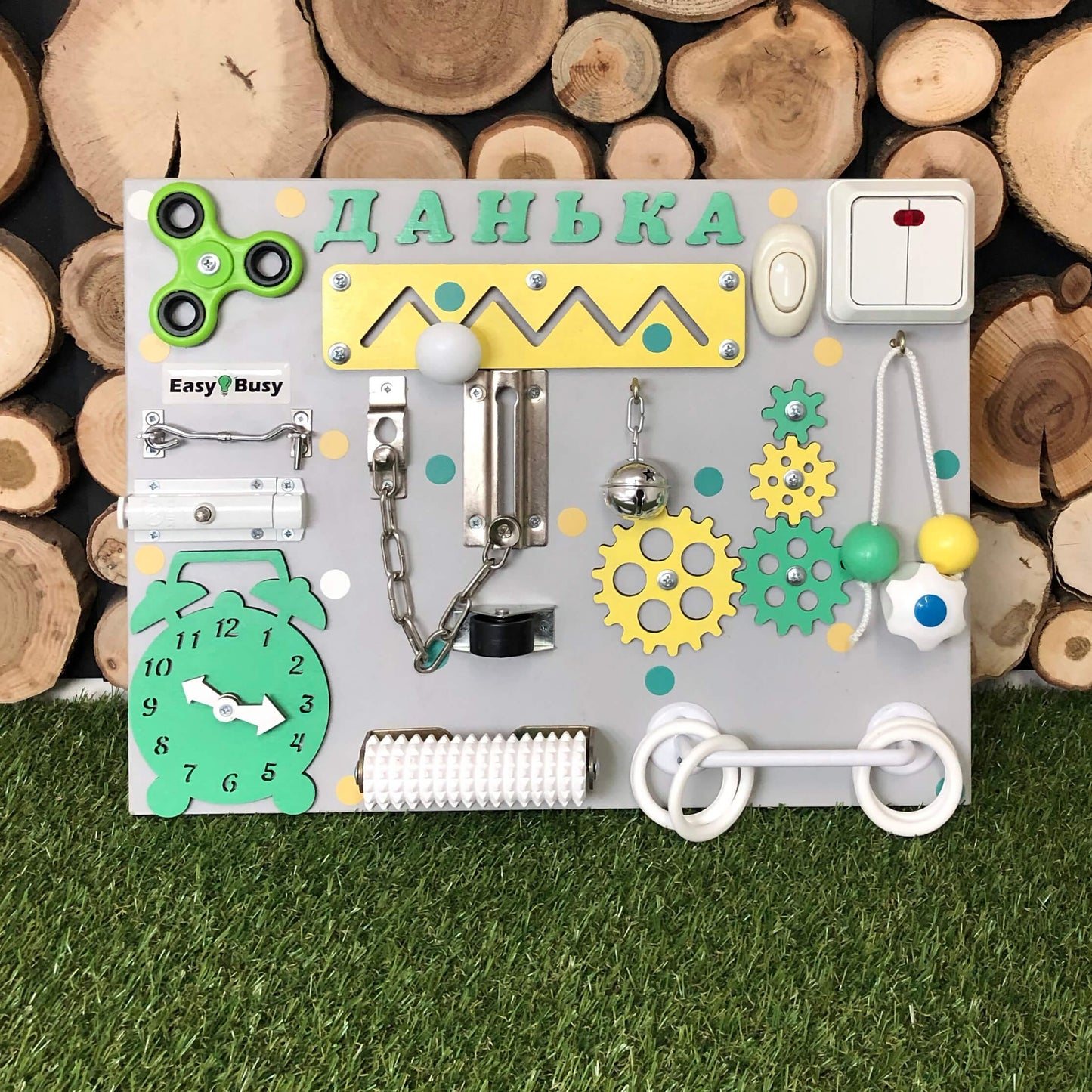 Compact activity board with white rotary switch and ring pull