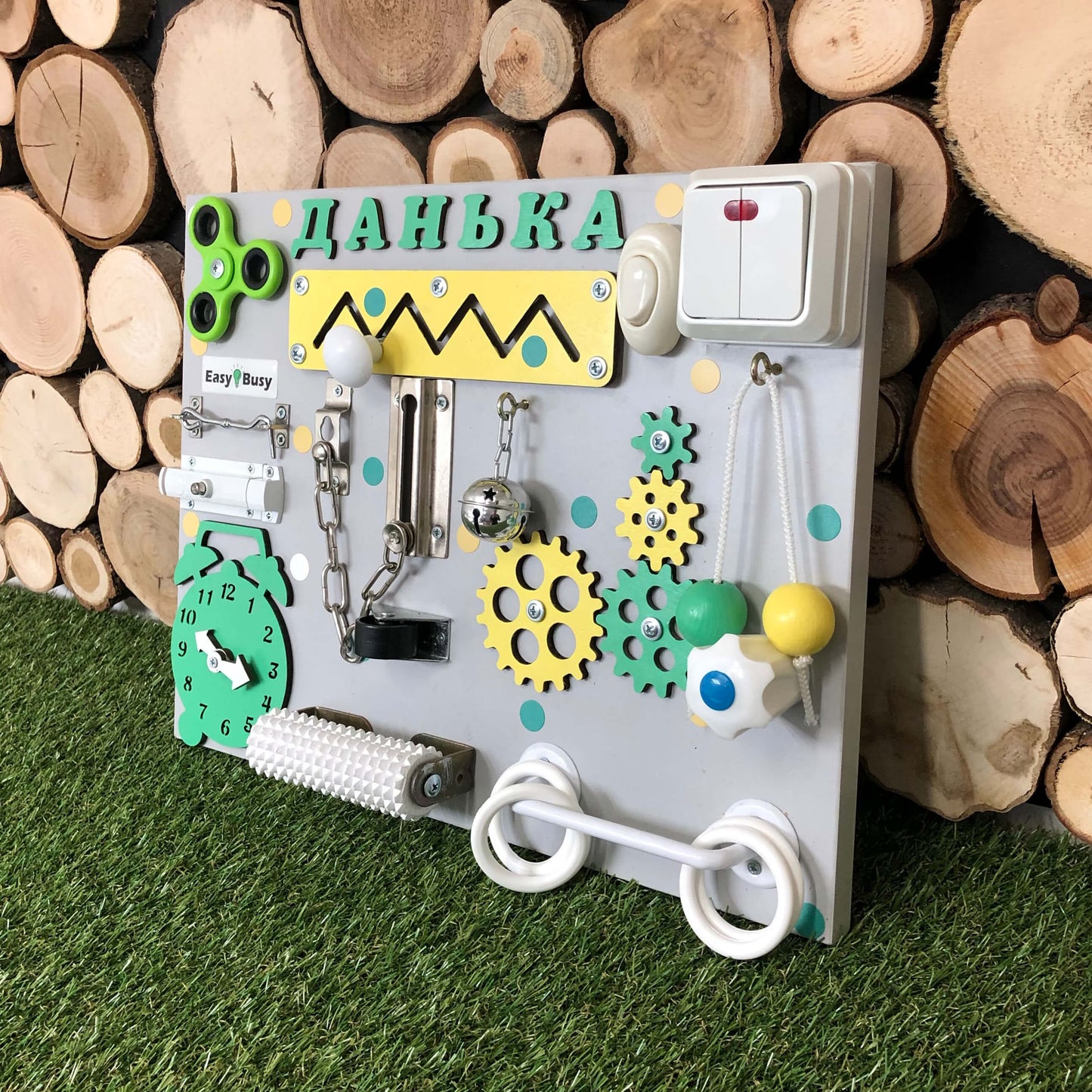 Sensory board with bell, clock, gears, and door bolt lock