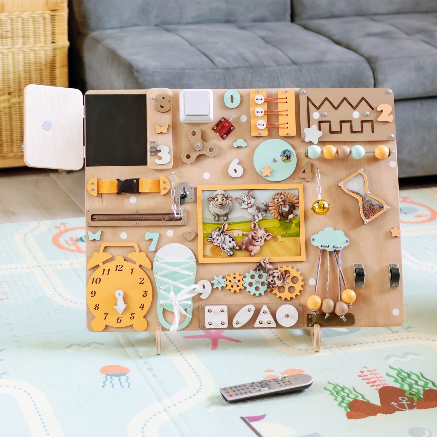 Magnetic cow and horse on an extra-large interactive wooden busy board