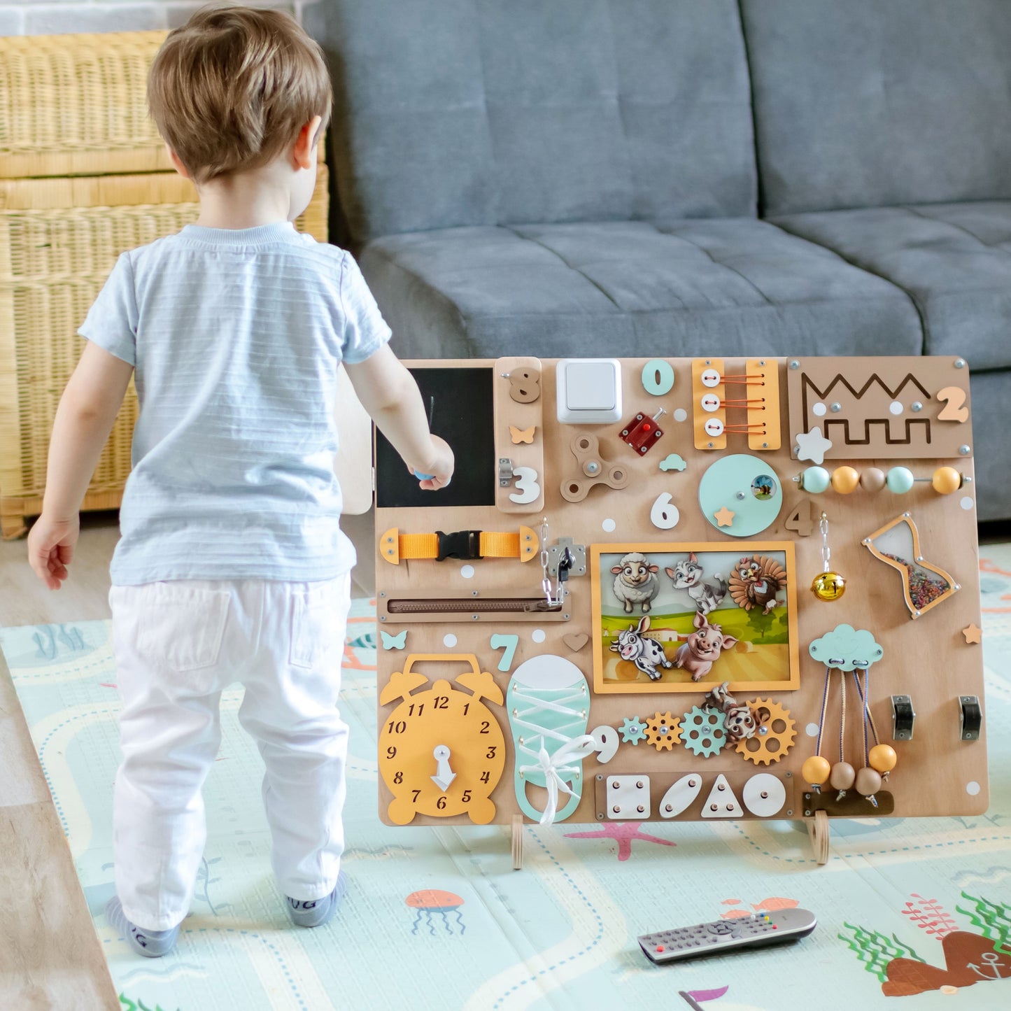 Handmade farm-themed busy board with removable magnetic farm animals