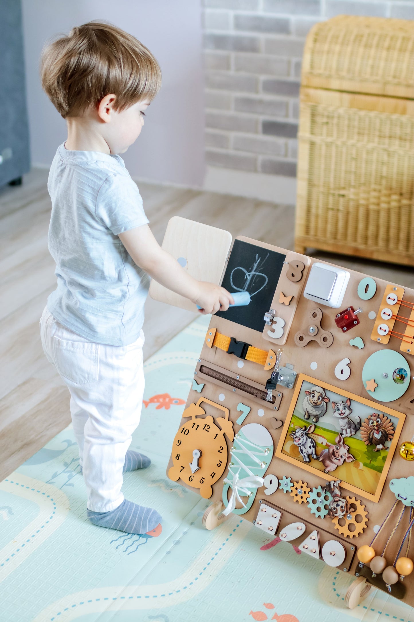 Fine motor skill development toy with a colorful barnyard background