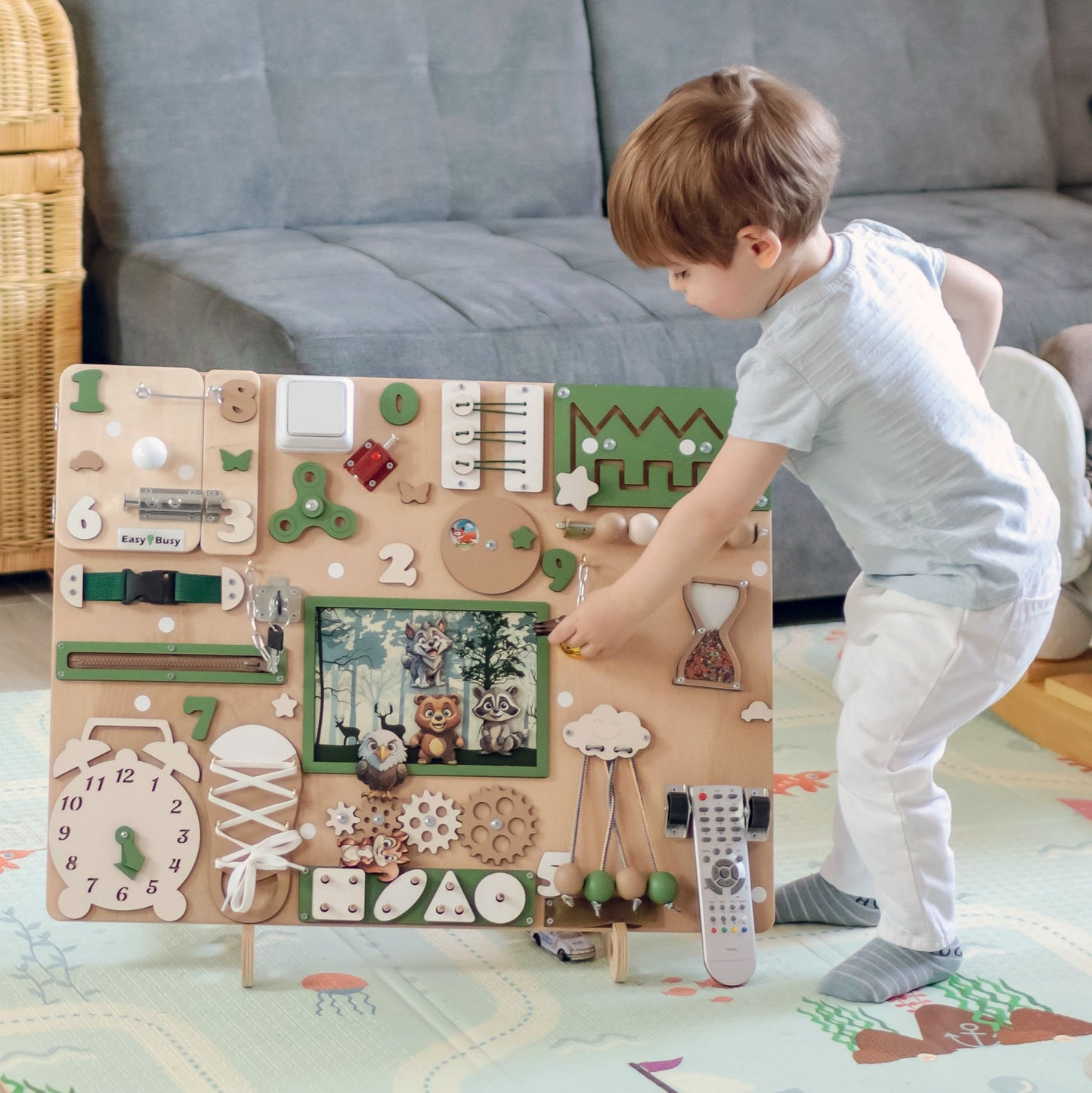 Toddler Playing with the Forest Busy Board – A child engaging with the interactive elements for sensory learning
