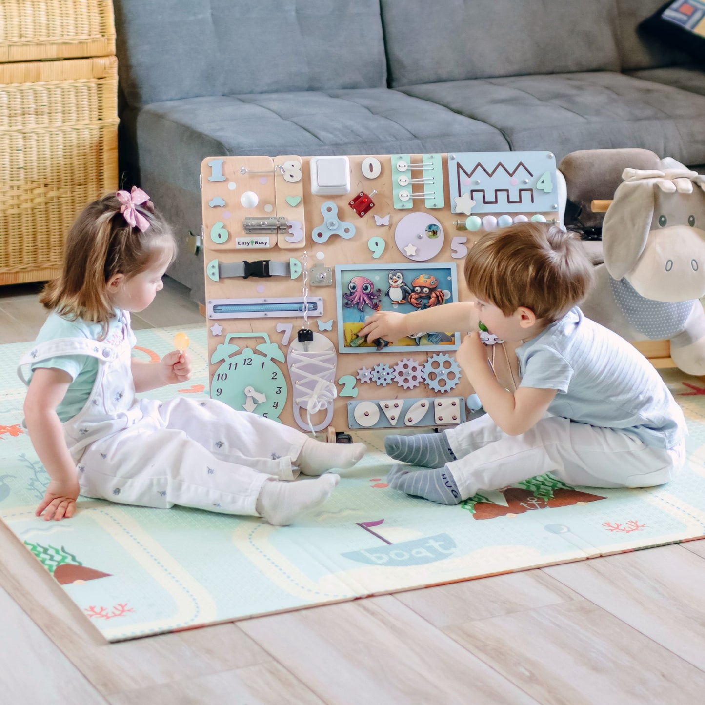 Fine motor skill development toy with a colorful coral reef background