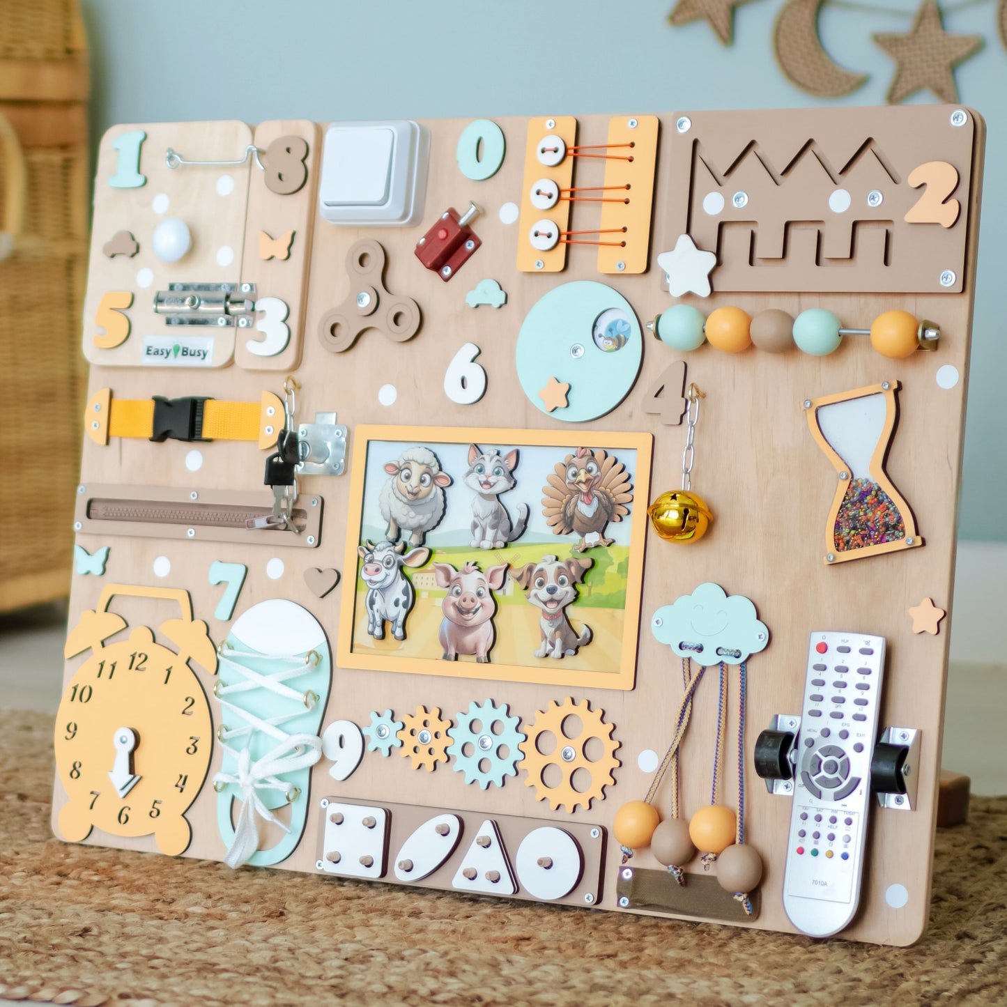 Close-up of removable magnetic animals on a farm sensory play panel