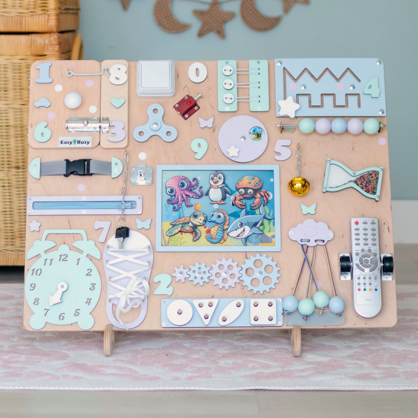 Toddler arranging magnetic sea animals on an oversized activity board