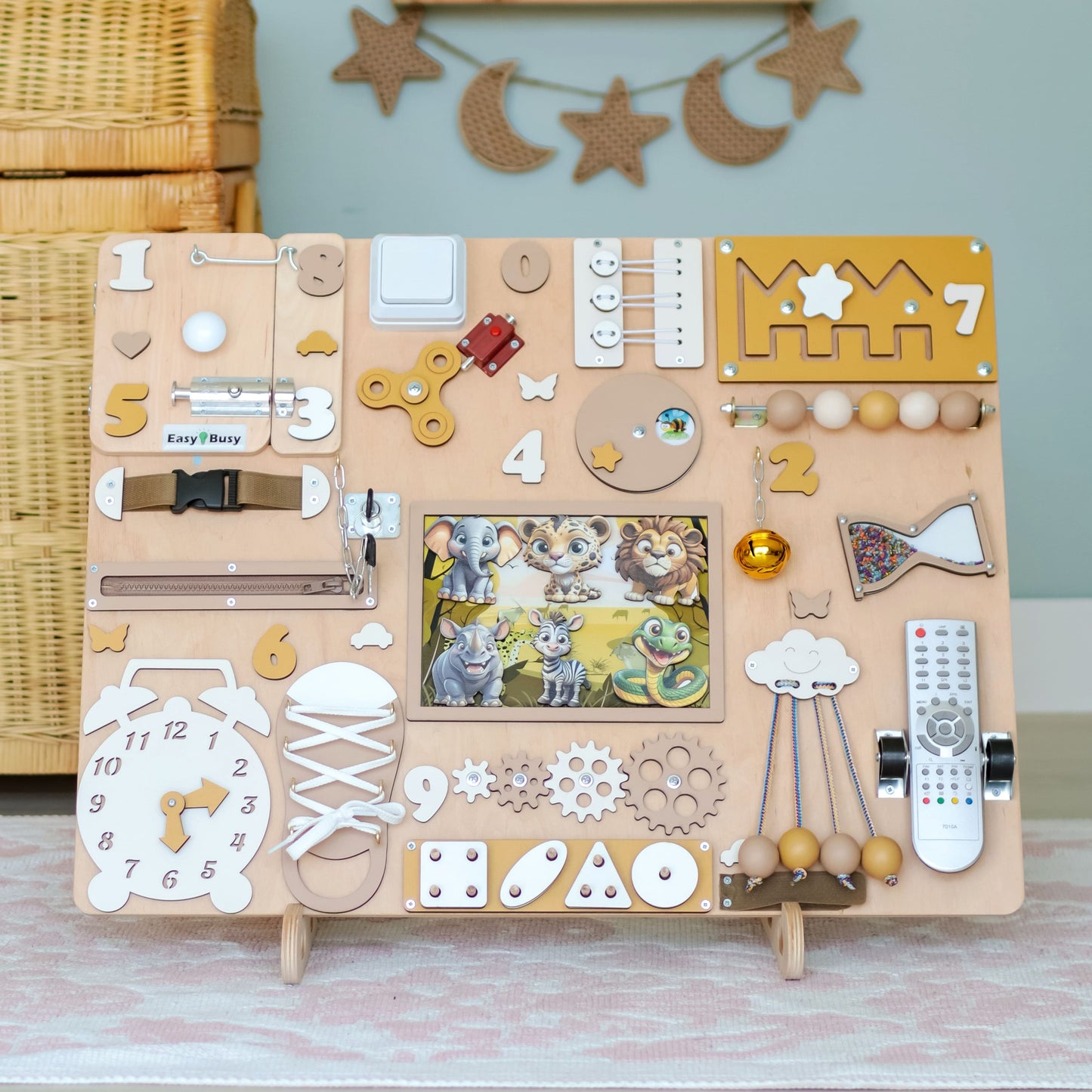 Montessori sensory play board featuring zebras, lions, and elephants