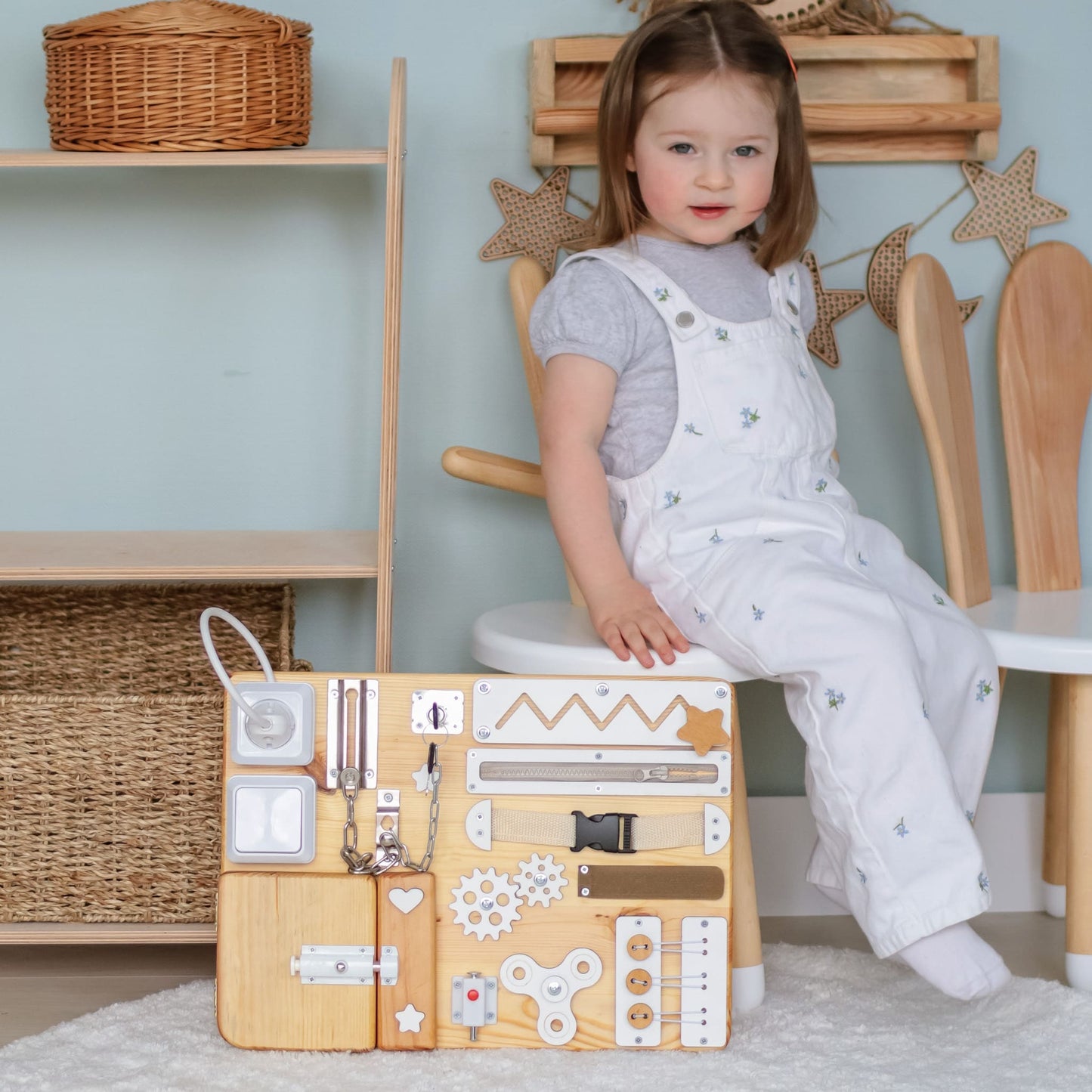 Handmade wooden activity board with gears and toggle