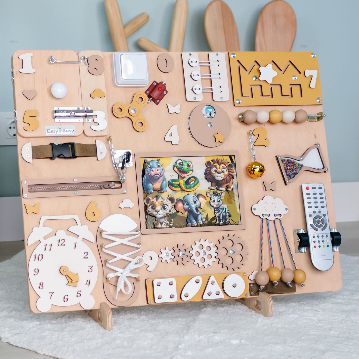 Large Montessori fine motor skill activity board with jungle animals